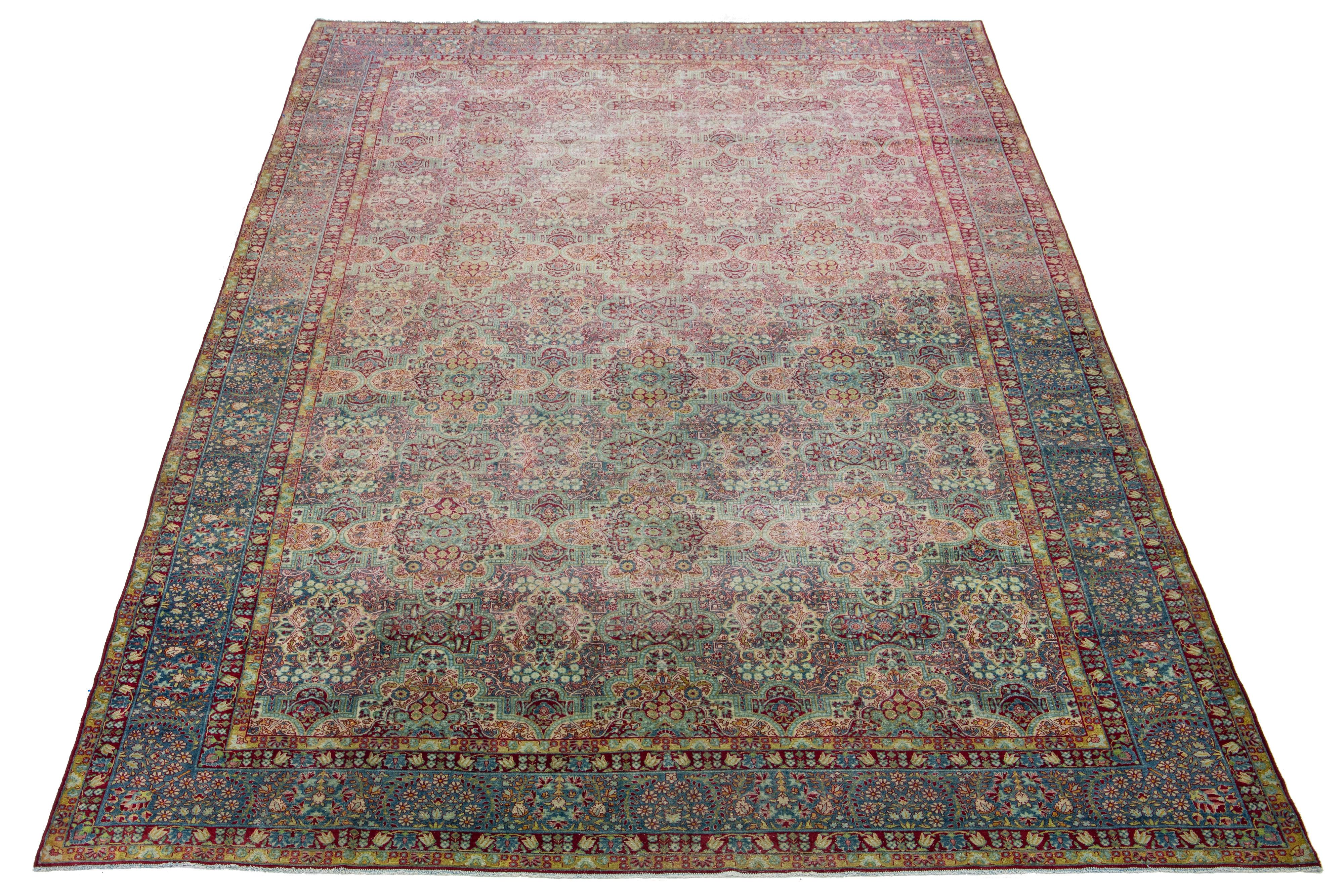 This Persian Tabriz wool rug is handcrafted and showcases a captivating traditional floral pattern. The mesmerizing contrast of the blue background and the exquisite red floral design enhances its charm.

This rug measures 10'10