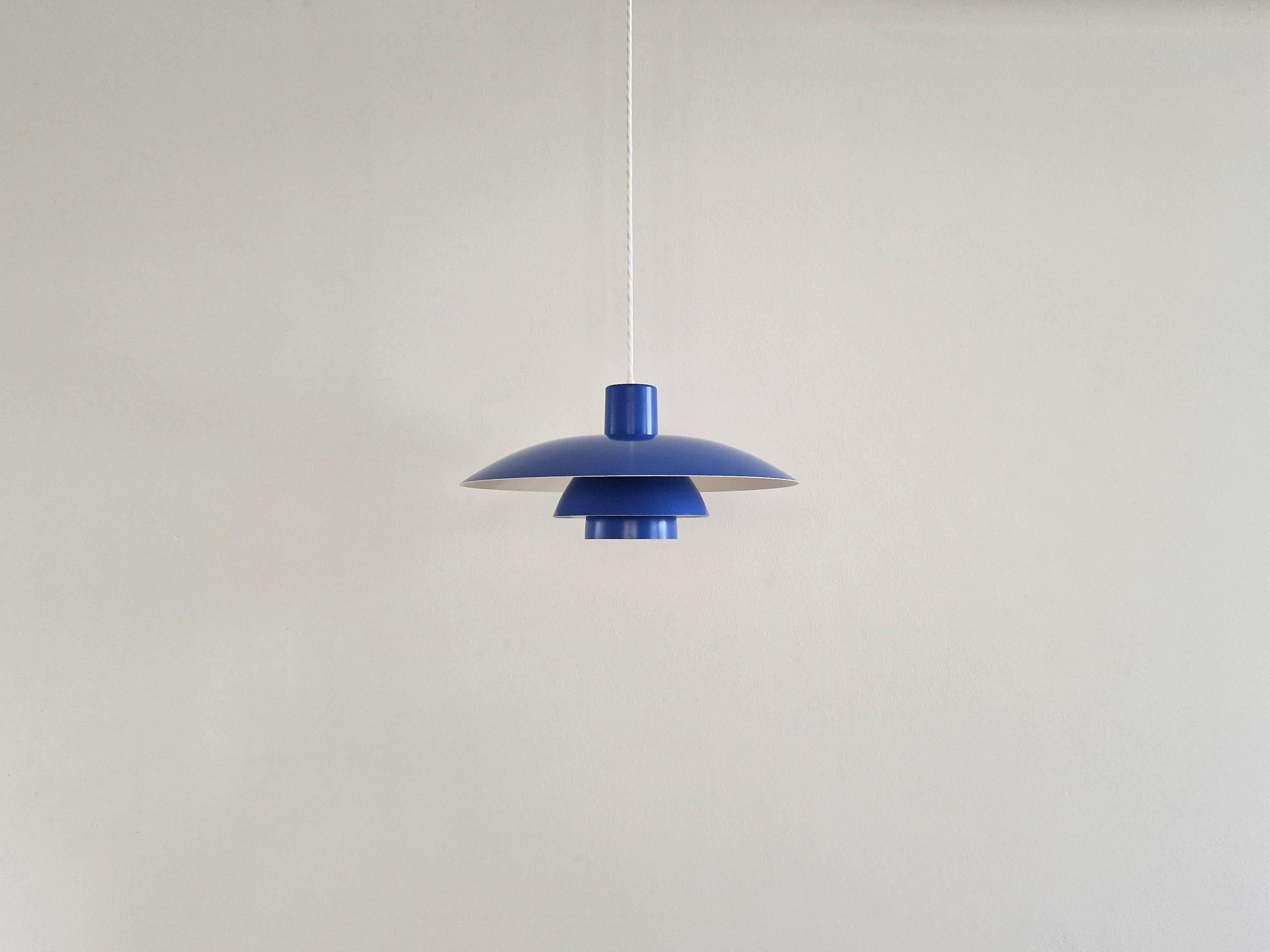 The PH 4/3 pendant lamp is a beautiful and classic design by Poul Henningsen. The lamp has been produced by Louis Poulsen since 1966 until today. This is an original and early version that was made in red, white and blue. We have all of these