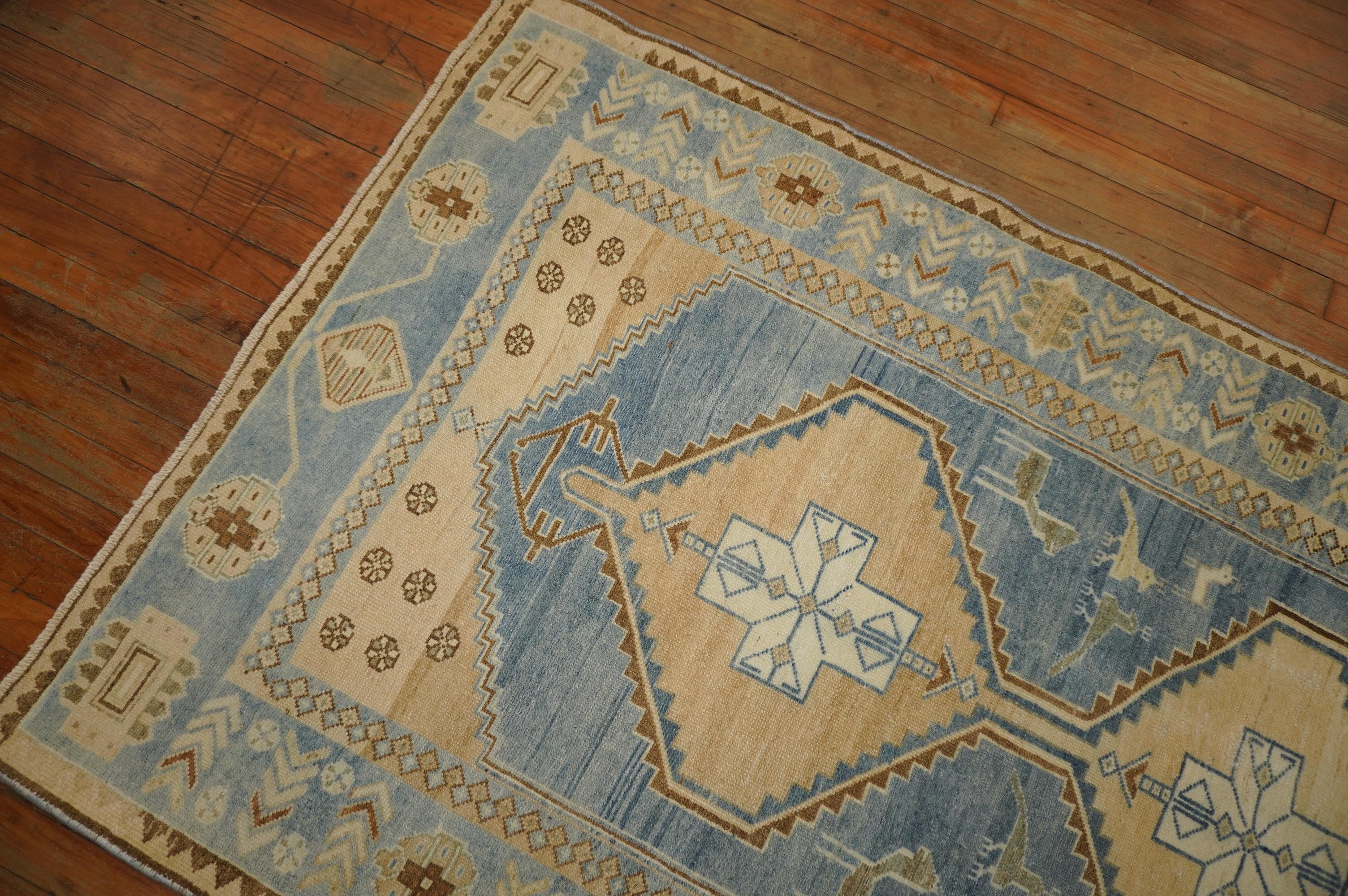 Predominantly blue wide Persian Malayer runner from the mid-20th century. Accents in straw and brown. Check the little pigeons floating in the field.

Measures: 3'8'' x 9'9