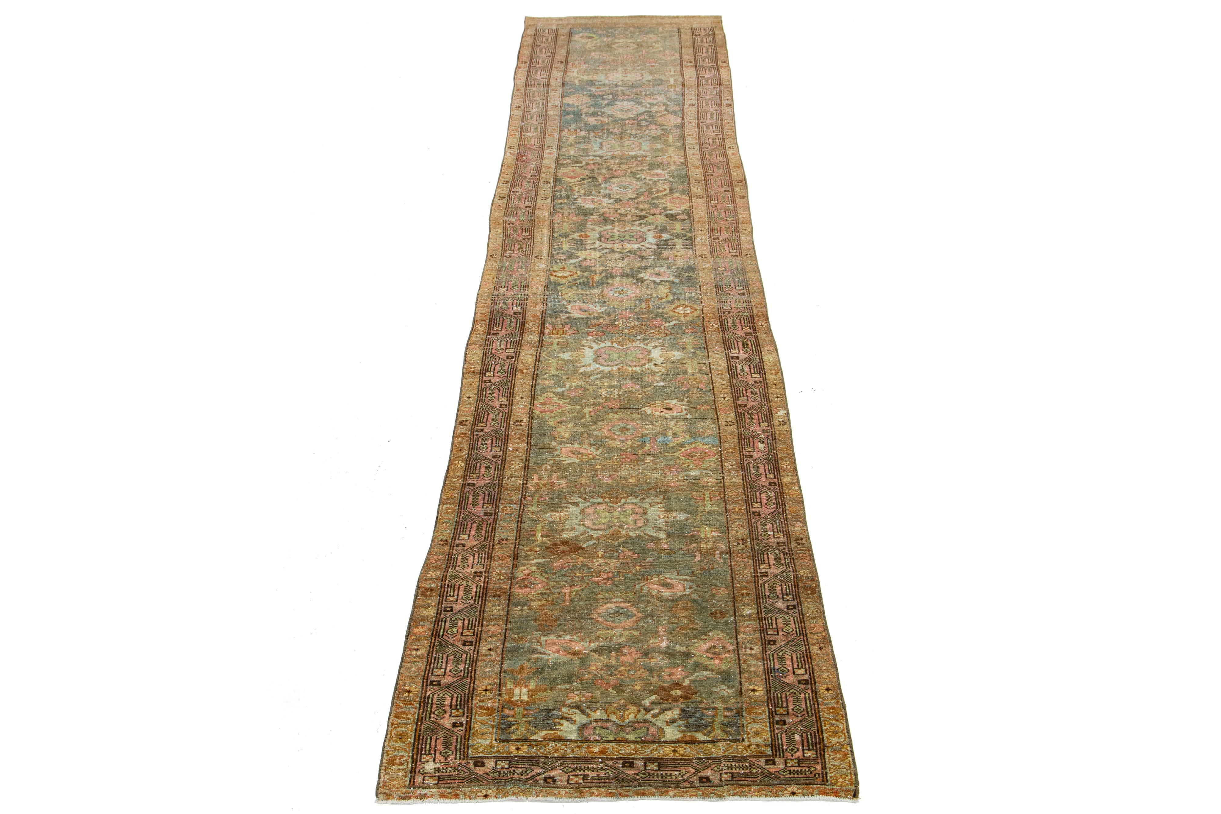 Beautiful antique Lilihan hand-knotted wool with a blue field. This Persian has pink borders with an all-over floral pattern design in brown and beige accents. 

This rug measures 3'1