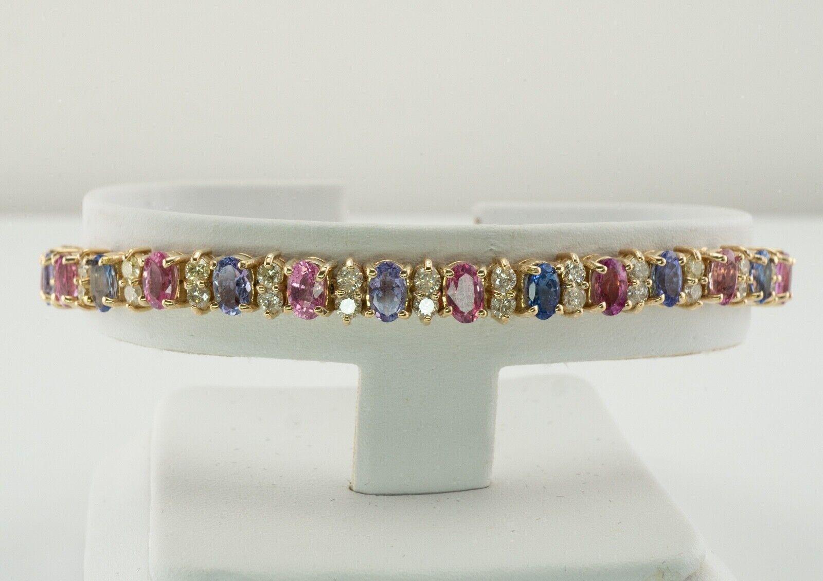 This estate bracelet is crafted in solid 14K Yellow Gold (carefully tested and guaranteed). It is set with genuine Earth mined blue and pink sapphires and diamonds. Each sapphire measures 5mm x 3mm totaling 10.15 carats for 29 gems. These sapphires