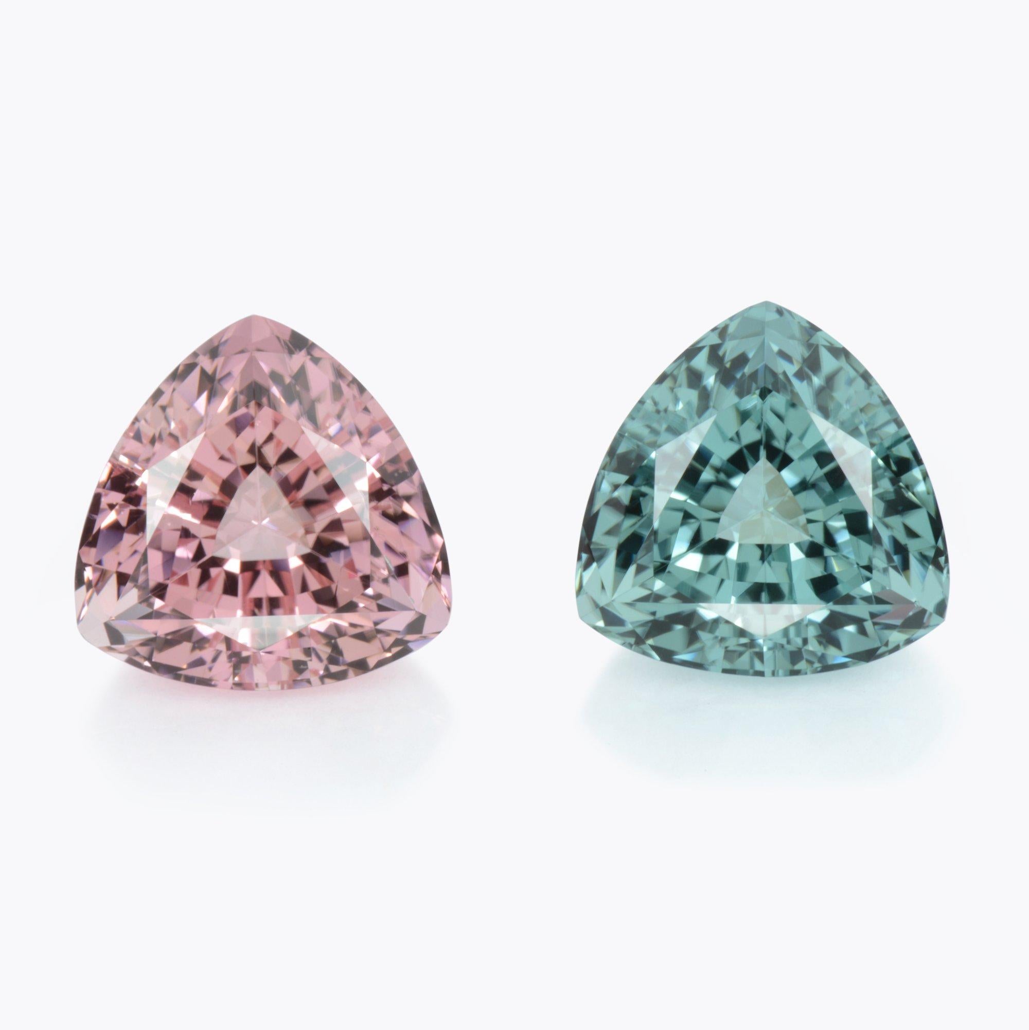 Unusual pair of 8.49 carats total, pink and blue Tourmaline trillion gems, offered loose to an elegant lady. 
These 