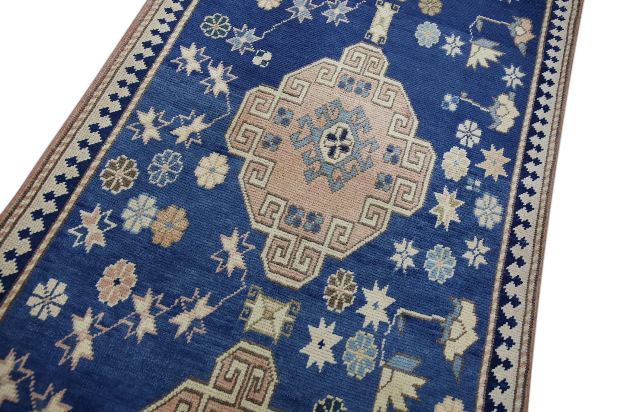 Introducing a one-of-a-kind vintage Turkish hand-knotted wool rug, carefully crafted by skilled artisans using traditional techniques passed down through generations. This exquisite rug boasts a stunning array of natural dyes, resulting in a rich