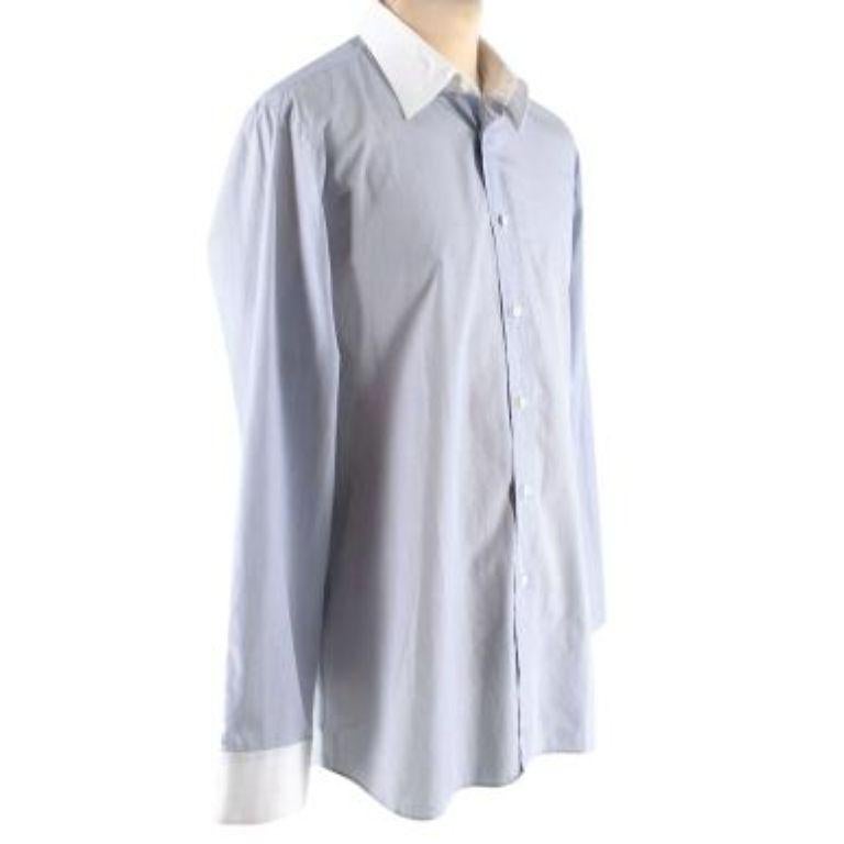 Prada Blue Pinstripe Cotton Poplin Shirt
 

 - Narrow pinstripe body with white cuffs and collar
 - Button front, button finished cuffs
 - Rounded bottom hem 
 

 Materials 
 100% Cotton 
 

 Made in Italy 
 Cold hand wash inside out 
 

 PLEASE