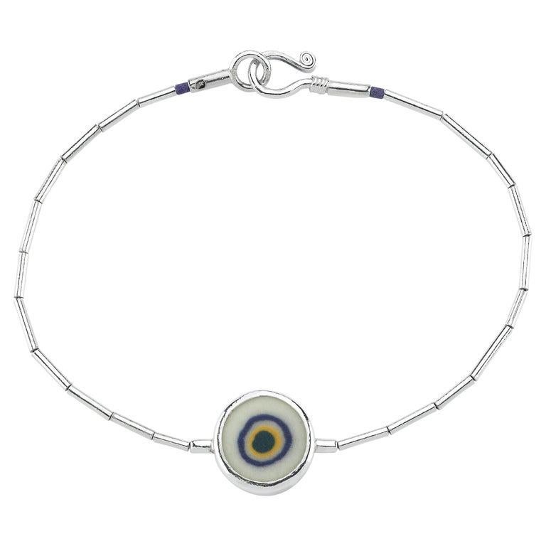 Evil Eye Bead made from porcelain. Sterling Silver. You can choose this design as a bracelet or necklace. Feel free to contact us.
Other color options are blue, green, orange, red. We also have different shapes. Do not hesisate to ask your favorite