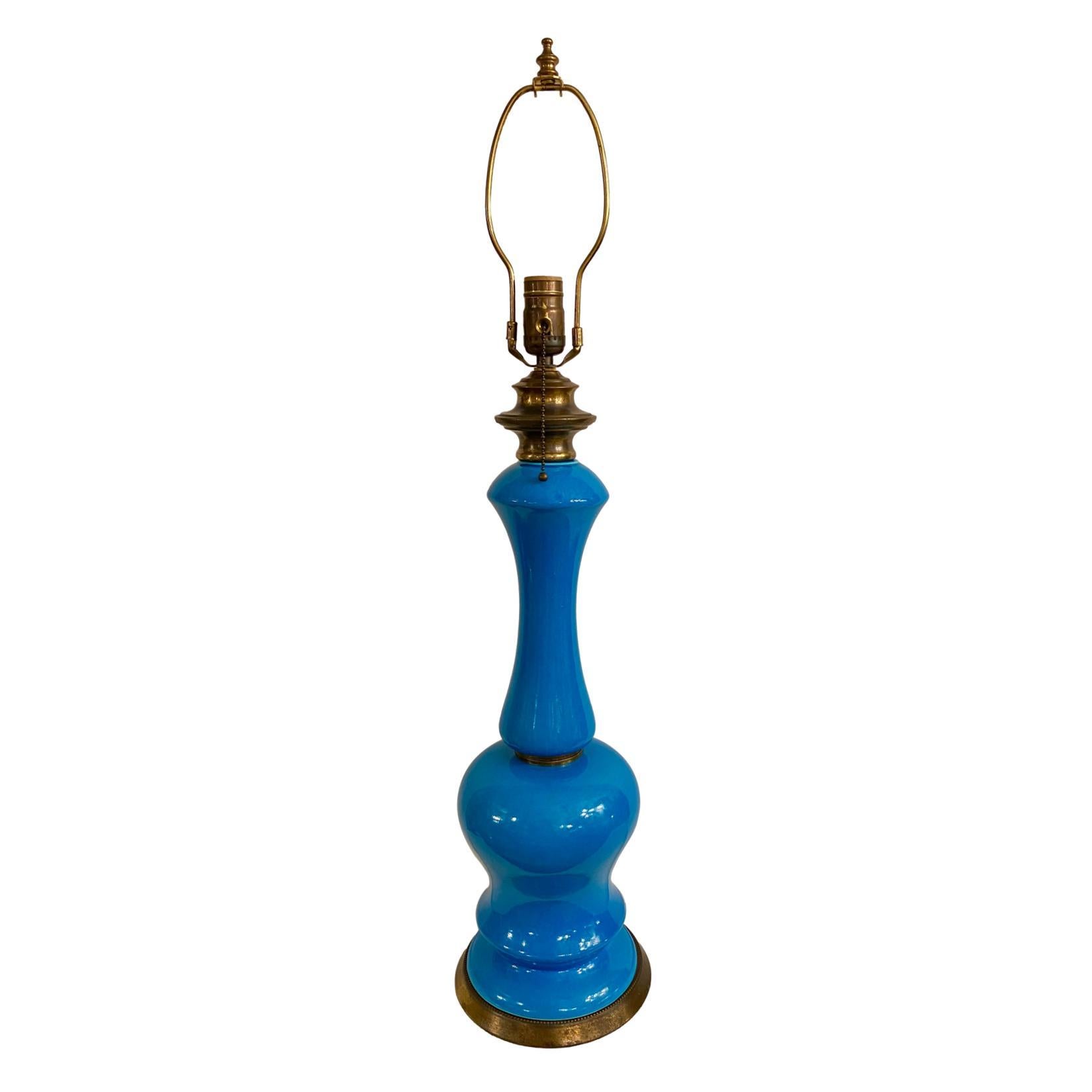 A single French circa 1940's azure blue porcelain table lamp.

Measurements:
Height of body: 21