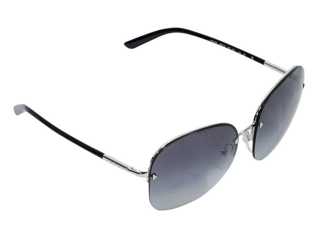 Product details:  Blue frameless square sunglasses by Prada.  Gradient lenses.  Cushioned nose pads.  Silvertone hardware.  Authenticity card, original box and original case included.  2.5