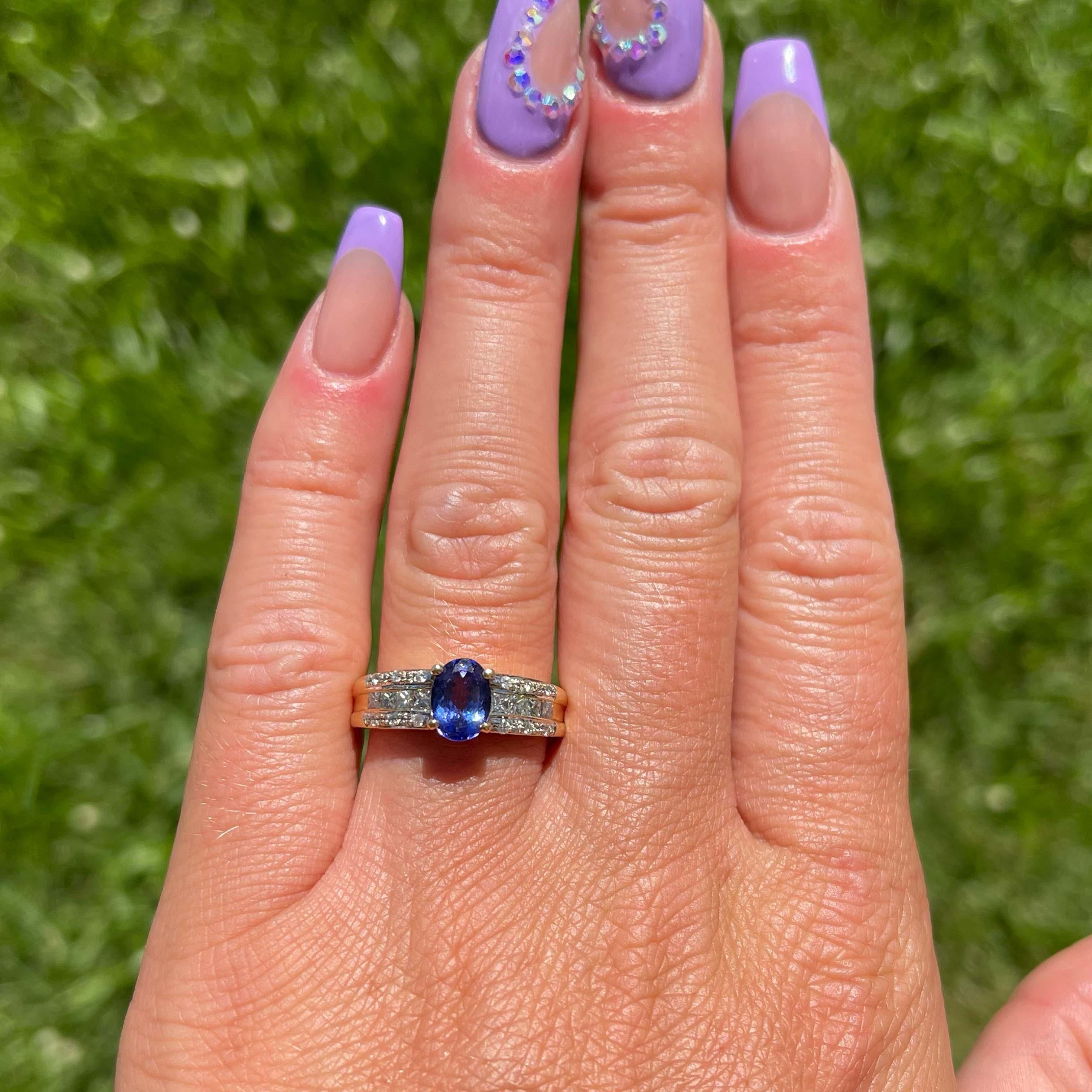 Blue Purple Tanzanite and Diamond Ring-18k Yellow Gold. Featuring a deep bluish purple color, oval shape Tanzanite, measuring approximately 7.55mm x 5.44mm x 3.51mm with an estimated total weight of 0.90 carats. The ring is set with 3 rows of