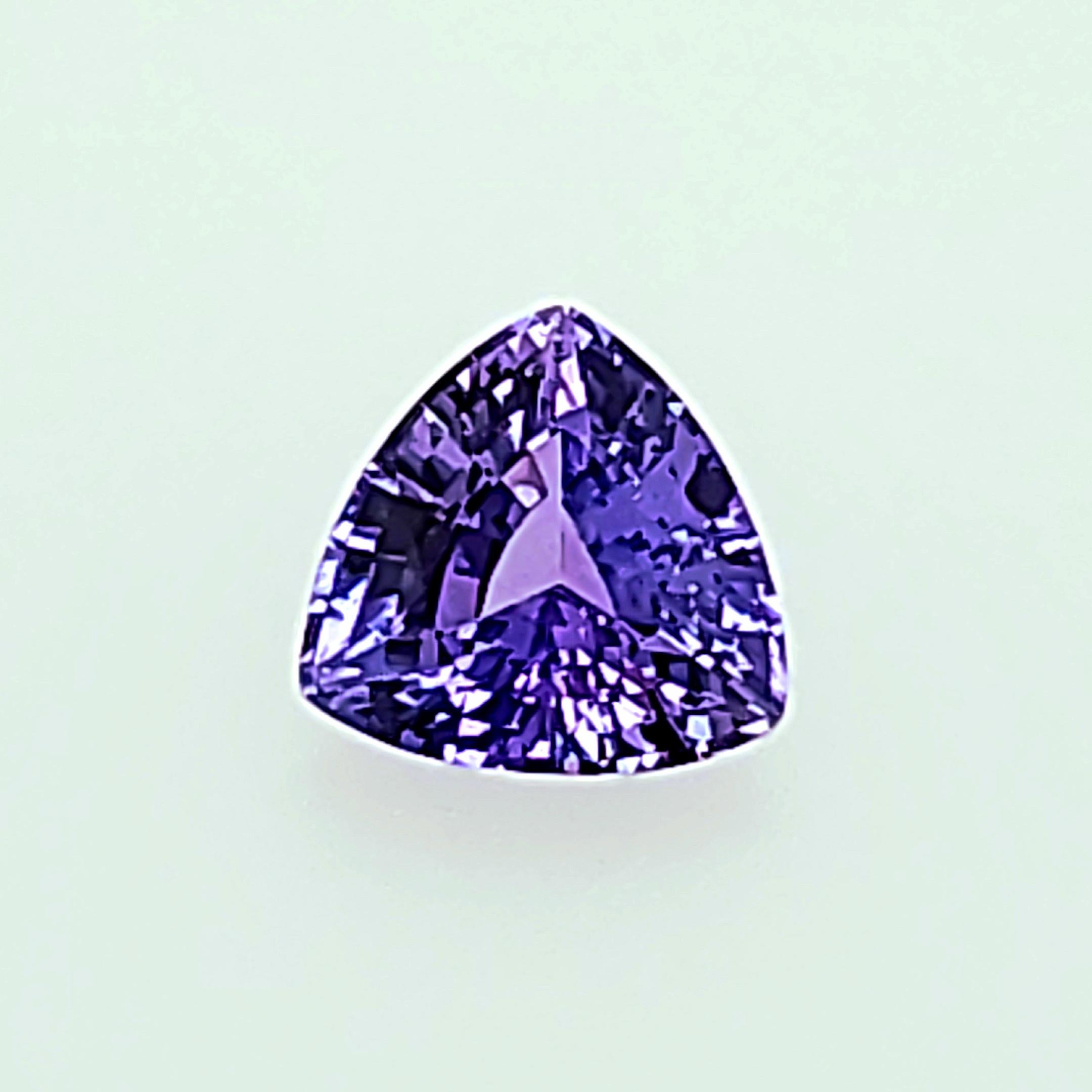 Bluish Purple to Purple depending on the lighting and wavelengths available, this 1.52ct Trilliant Sapphire could be a color shifint Sapphire.  Very Brilliant and Eye Catching and catches the light even under low light levels.  Most people think