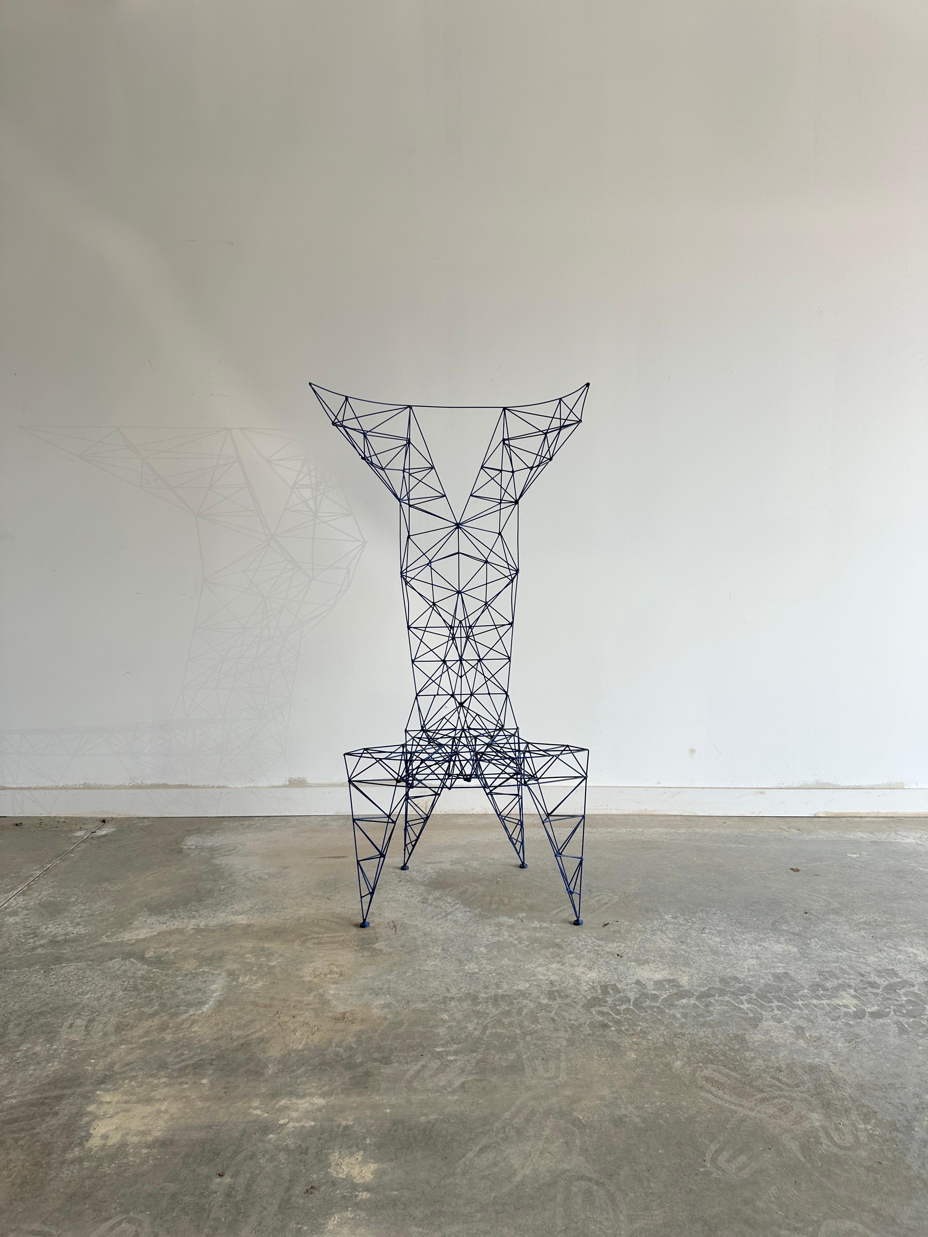 This striking chair is a creation of Tom Dixon, inspired by the industrial structures and bridges of London. The chair is made of hand-welded copper-plated steel rods, forming a geometric lattice. Dixon’s impetus for the Pylon chair was to design