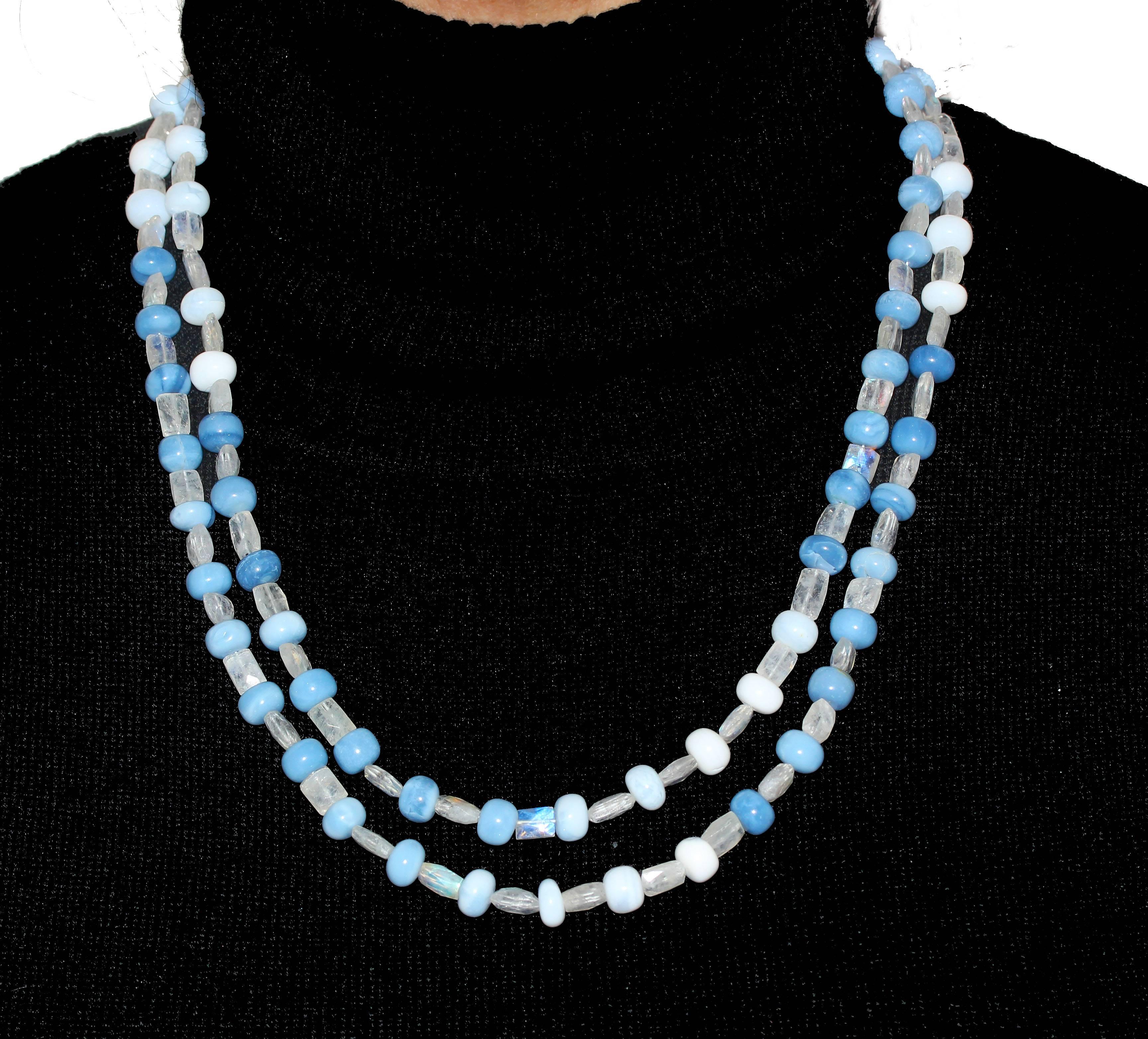 Shaded from dark blue to white-ish these rare beautiful newly discovered Peruvian Opal gemstones are enhanced with glowing gems of natural Moonstone set with a sterling silver clasp.  This necklace is 21 inches long and is perfect for day into night