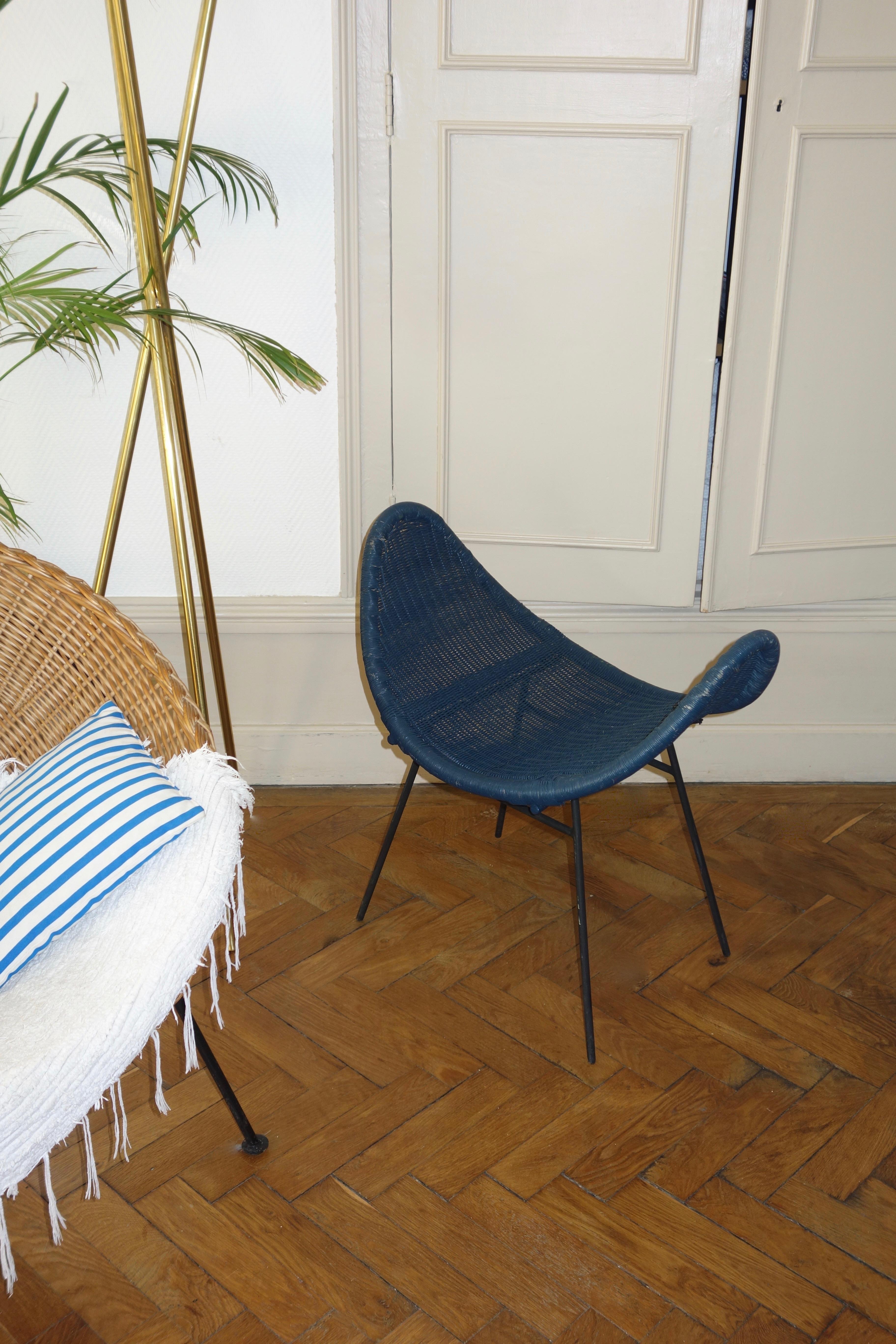 Original vintage rattan stool. Metal structure and seat in woven rattan painted blue. Atypical model, patinated with traces of use and removable. Beautiful room very deco, to divert in side table or in footrest.
 