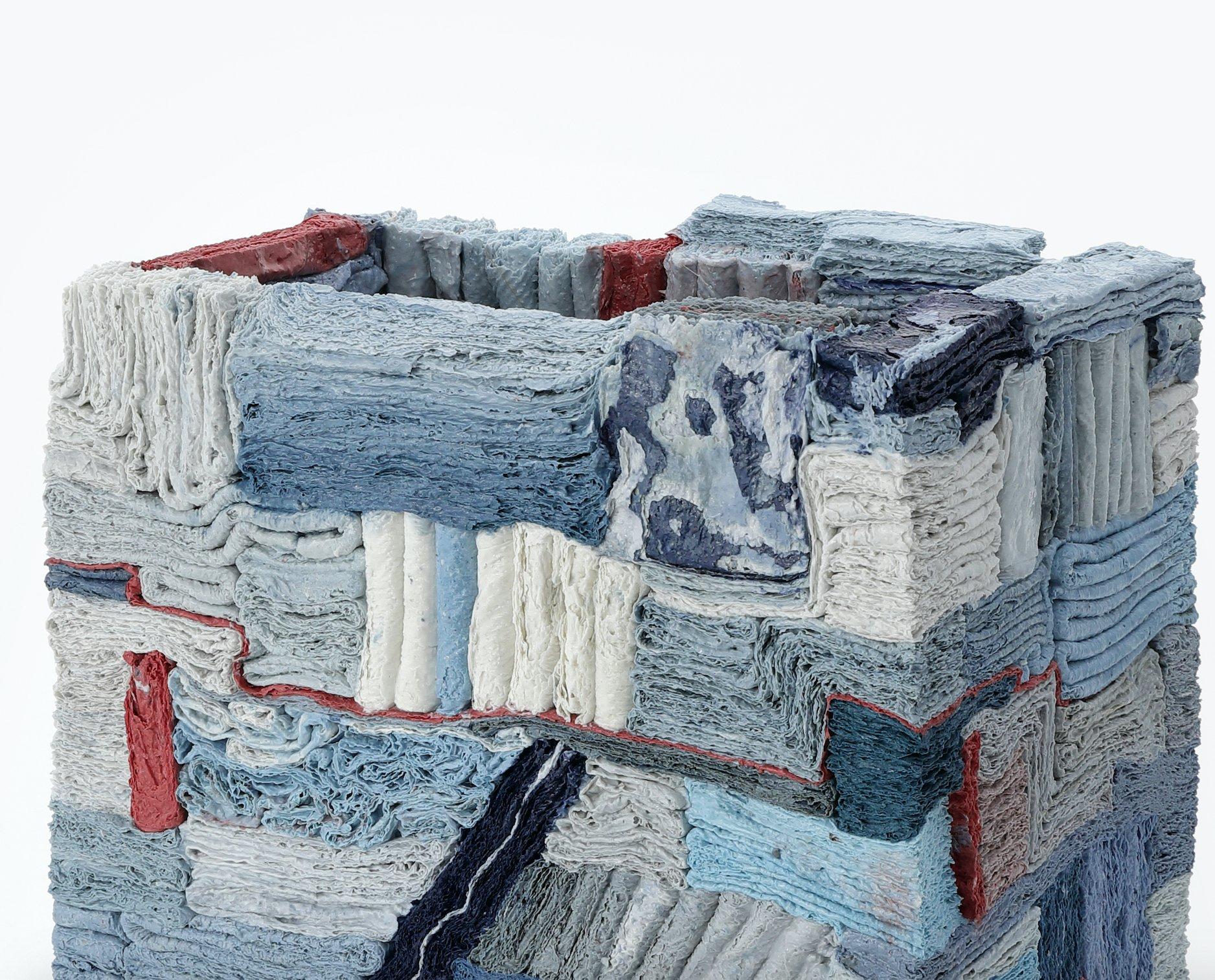 Blue Patchwork, 2023 (Ceramic, C. 11.4 in. h x 9.8 in. w x 6.2 in. d, Object No.: 4203)

The artist harmoniously combines materials that are seemingly at odds with one another to create his sublime vases and sculptural vessels. He paints porcelain