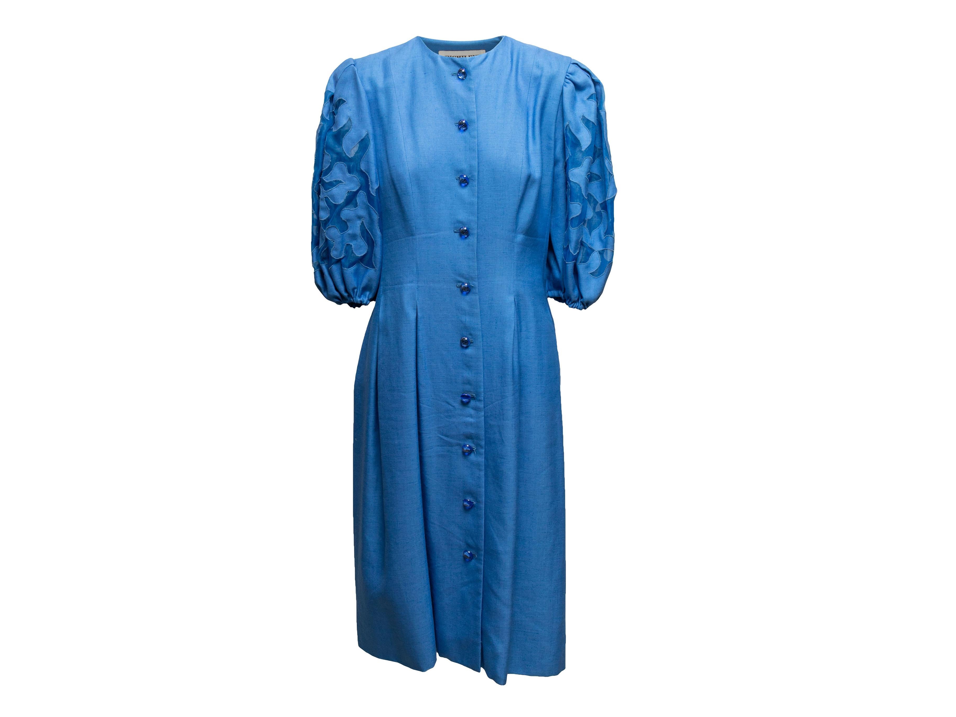 Blue short puff sleeve dress by Richilene. Crew neck. Button closures at center front. 32