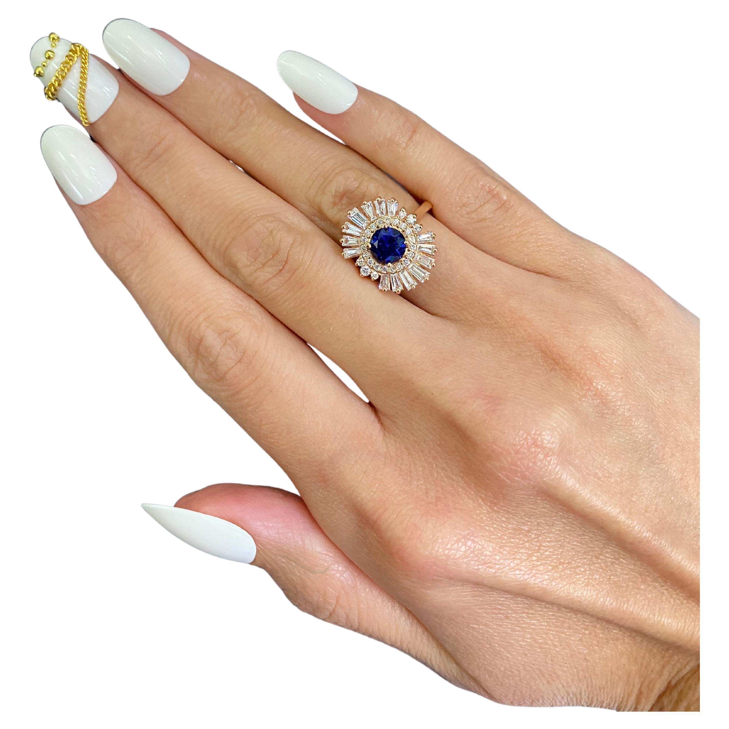 Art Deco-Ring aus 18 Karat Roségold mit blauem, rundem Saphir und Baguette-Diamant und Halo-Sonnenstrahl 