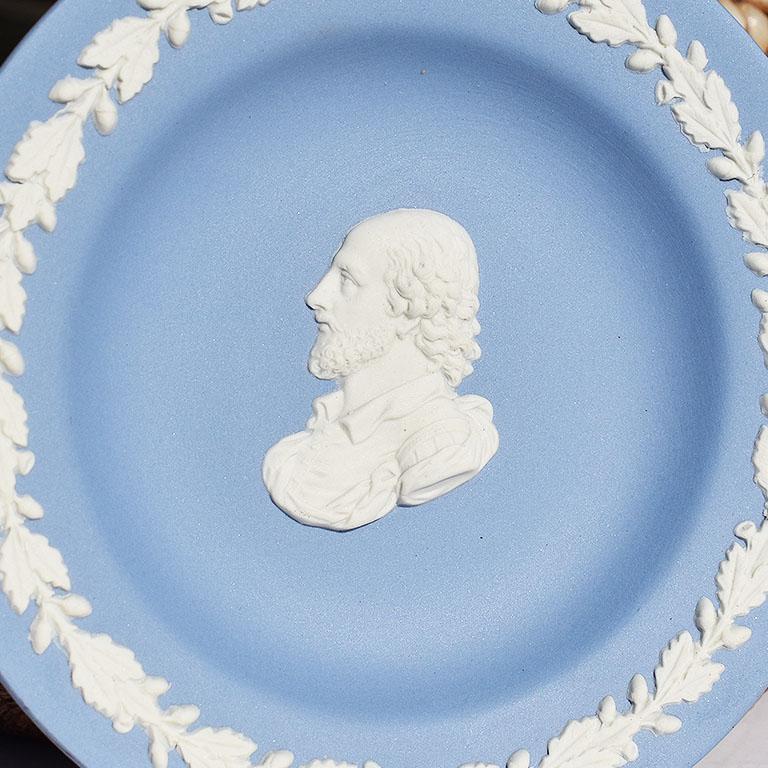Jasperware dish in blue and white. This round dish is blue with white floral decorations at the edges. At the center, a man with a beard is featured. Signed at bottom Wedgwood Made in England.

Specifications:
4.32