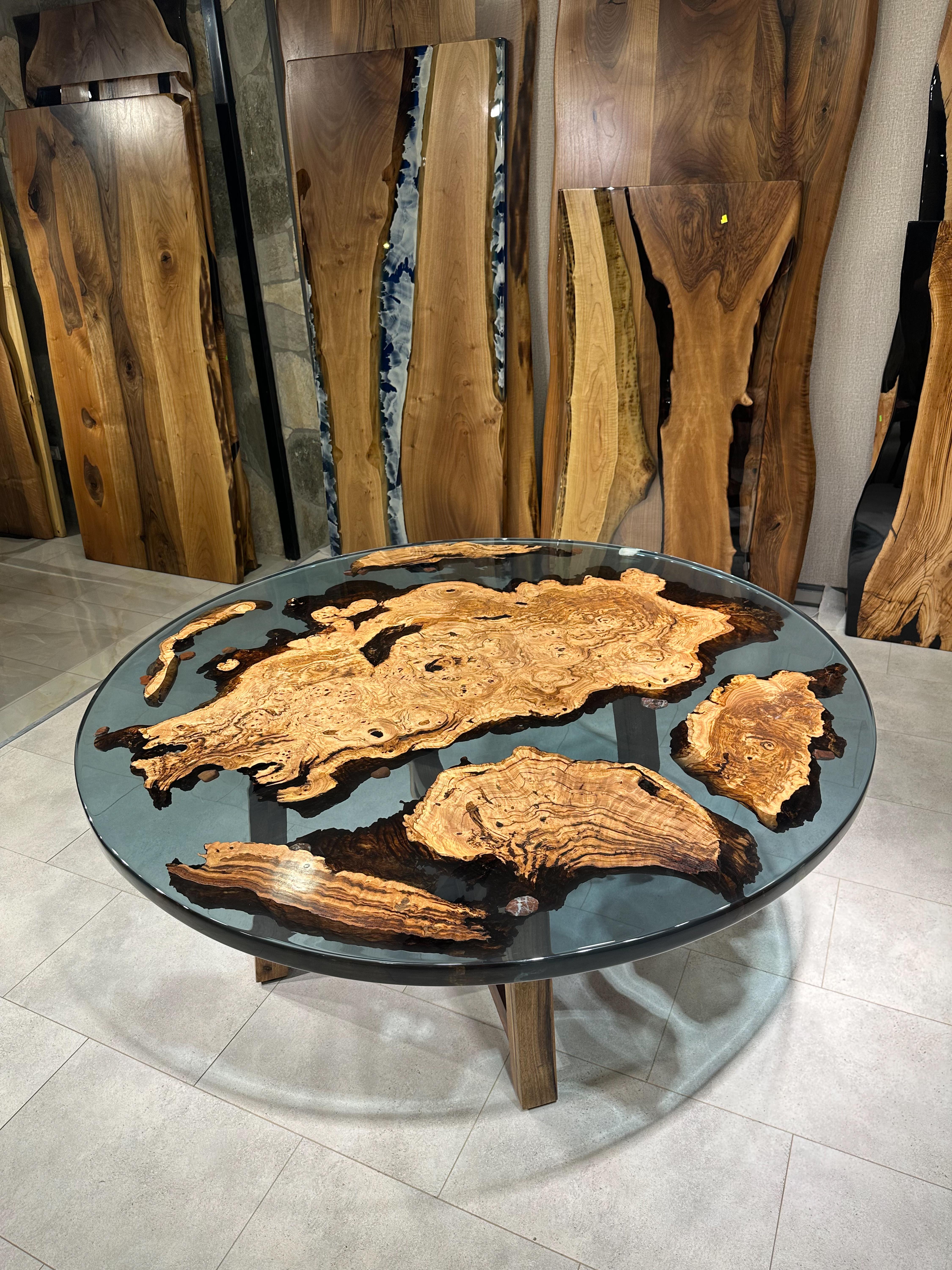 Walnut Custom Blue Epoxy Resin Round Dining Table 

This table is made of 500 years old walnut wood. The grains and texture of the wood describe what a natural walnut woods looks like.
It can be used as a dining table or as a conference table.