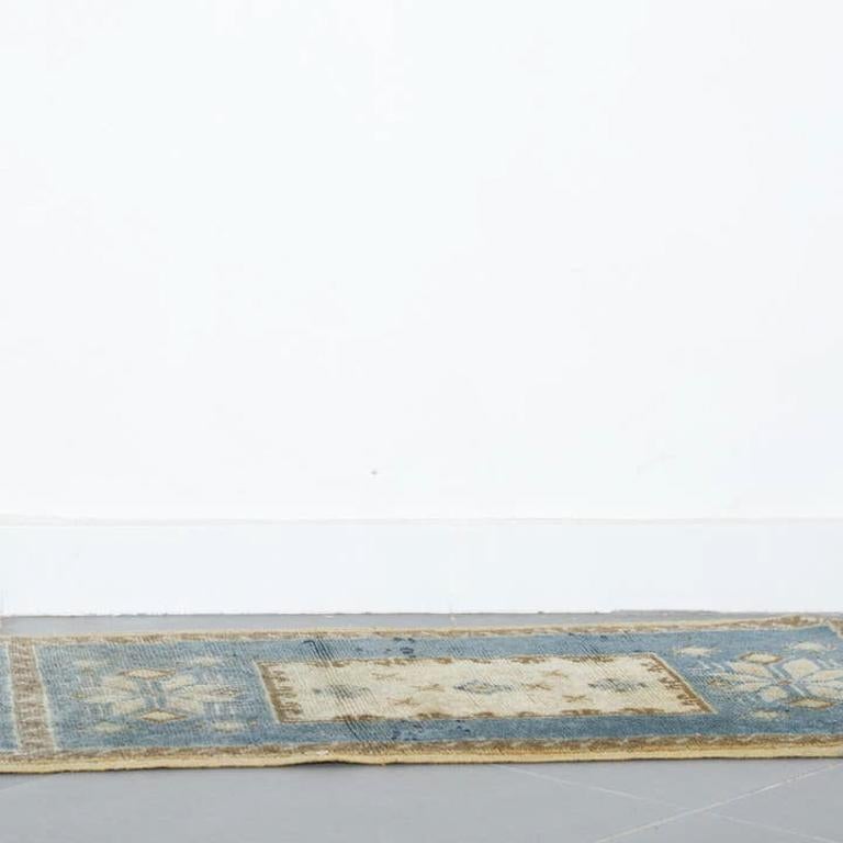 Balanced composition of traditional medallion motifs in , ivory, sand, blue tones. Handcrafted by Berber artisans using traditional wool weaving techniques.

Dimensions: 23” x 78 