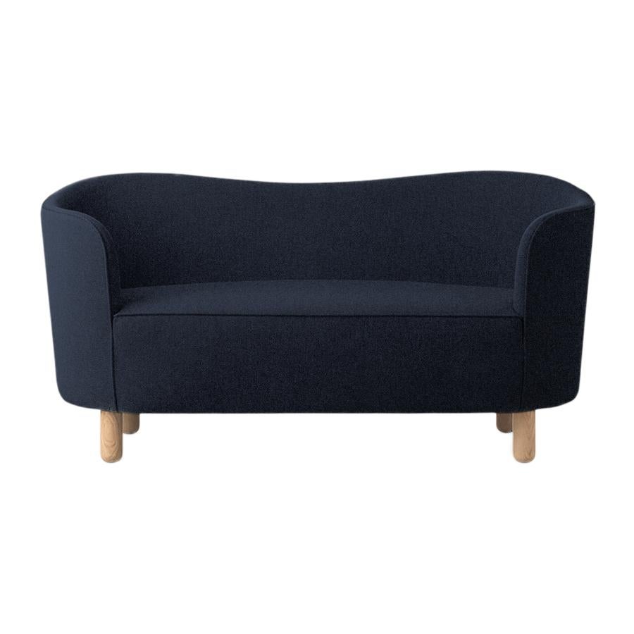 Blue Sahco zero and natural oak mingle sofa by Lassen.
Dimensions: W 154 x D 68 x H 74 cm. 
Materials: Textile, oak.

The Mingle sofa was designed in 1935 by architect Flemming Lassen (1902-1984) and was presented at The Copenhagen