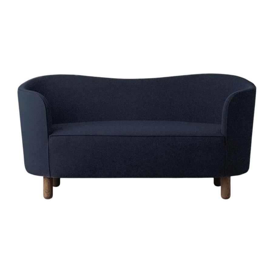 Blue Sahco zero and smoked oak mingle sofa by Lassen.
Dimensions: W 154 x D 68 x H 74 cm. 
Materials: Textile, Oak.

The Mingle sofa was designed in 1935 by architect Flemming Lassen (1902-1984) and was presented at The Copenhagen Cabinetmakers’