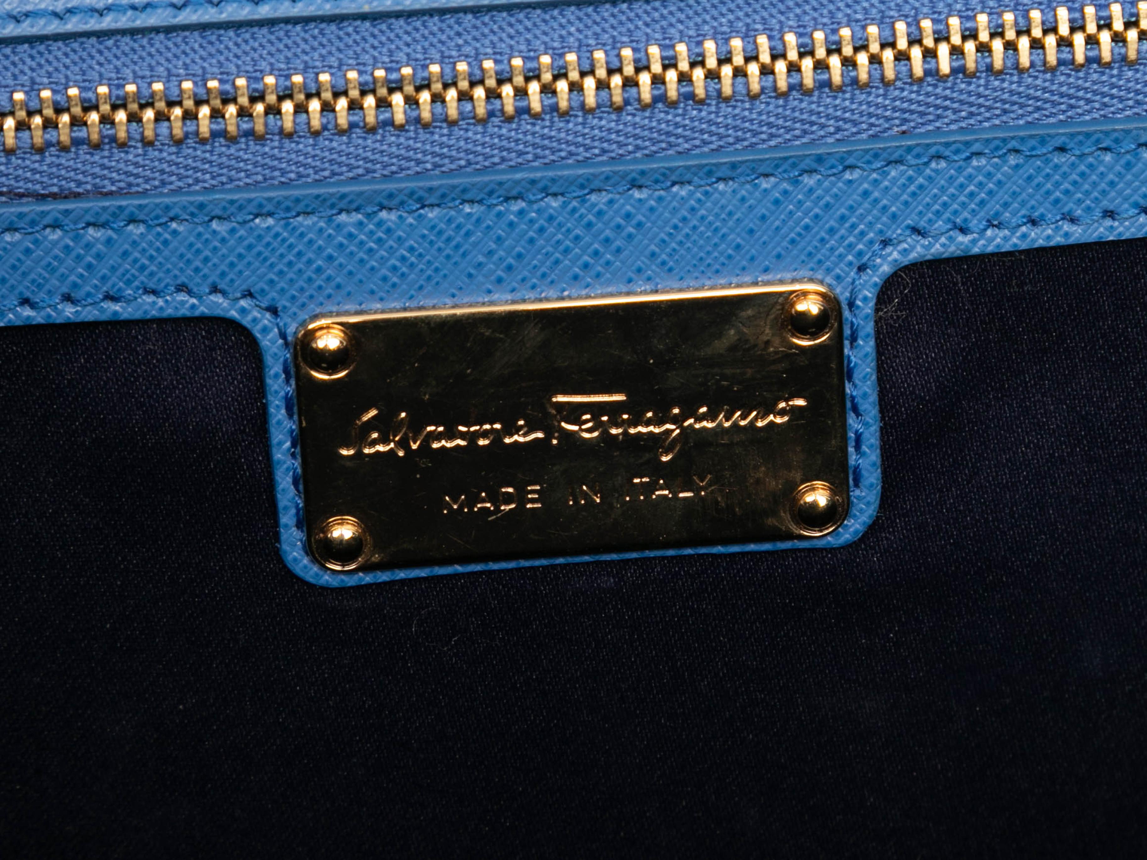 Blue Salvatore Ferragamo Vara Bow Bag. The Vara bag features a leather body, gold-tone hardware, a single chain-link and leather strap, and a front flap closure. 10