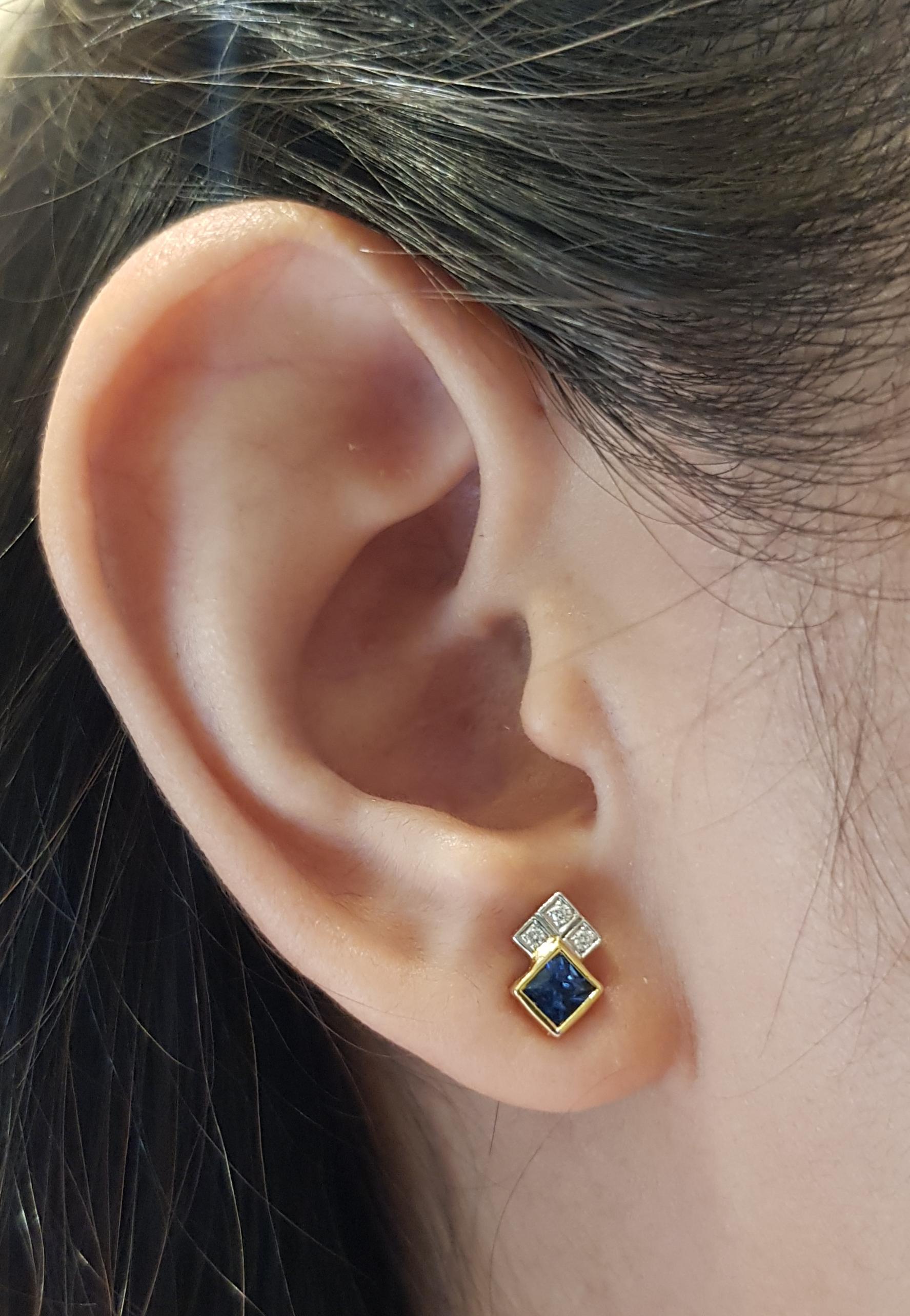 Blue Sapphire 0.58 carat with Diamond 0.05 carat Earrings set in 18 Karat Gold Settings

Width:  0.6 cm 
Length: 0.9 cm
Total Weight: 1.94 grams

