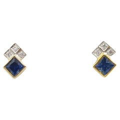 Blue Sapphire 0.58 Carat with Diamond 0.05 Carat Earrings Set in 18 Karat Gold S