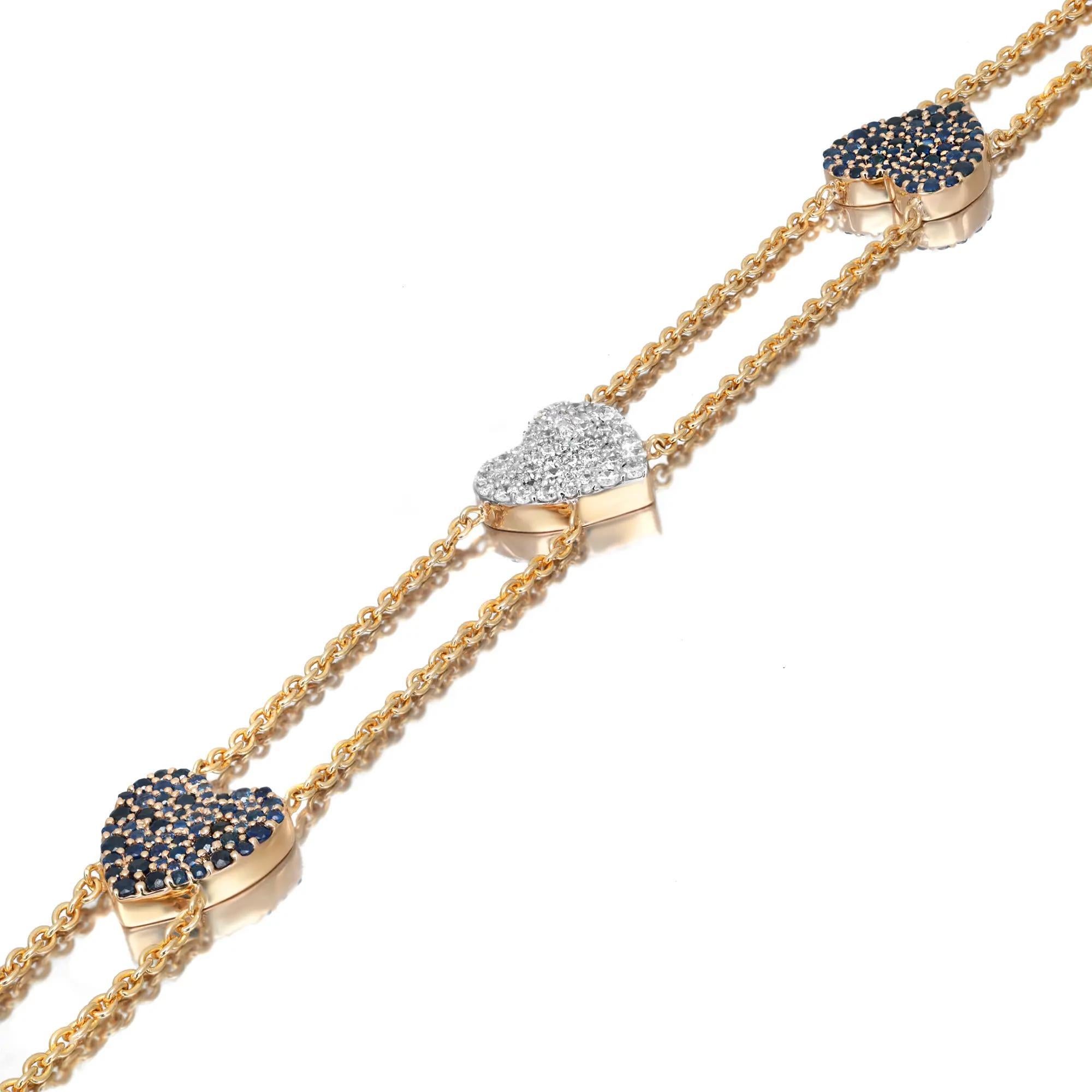 This stunning three hearts motif bracelet is a perfect valentine's gift for your loved one. Crafted in 14k yellow gold, it features pave set round cut diamonds encrusted in the center heart motif with two pave set blue sapphire hearts attached with