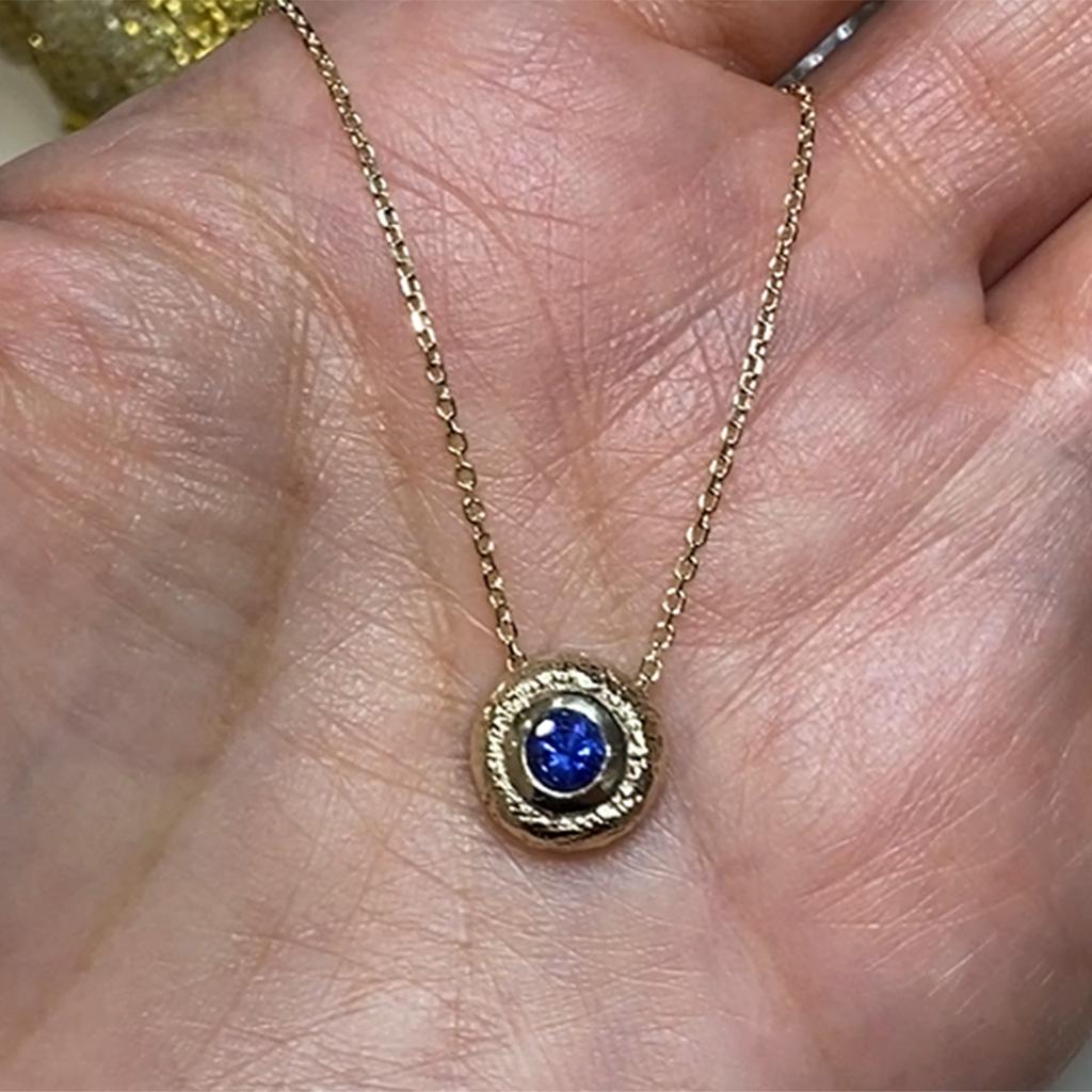 Contemporary Blue Sapphire 14 Karat Textured Yellow Gold Round Pendant by K.MITA For Sale
