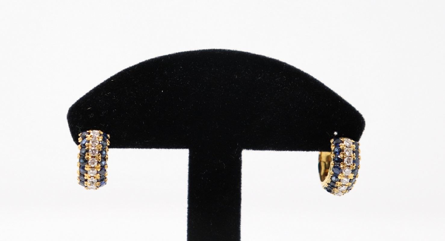18 Karat yellow gold fashion hoop earring with Central Blue Sapphire about 1.50 Carat and brilliant cut diamonds total about 0.60 Carat. 
Total weight: about 8 g.
New contemporary jewelry. Produced in the famous Italian city of gold Valenza. 
This