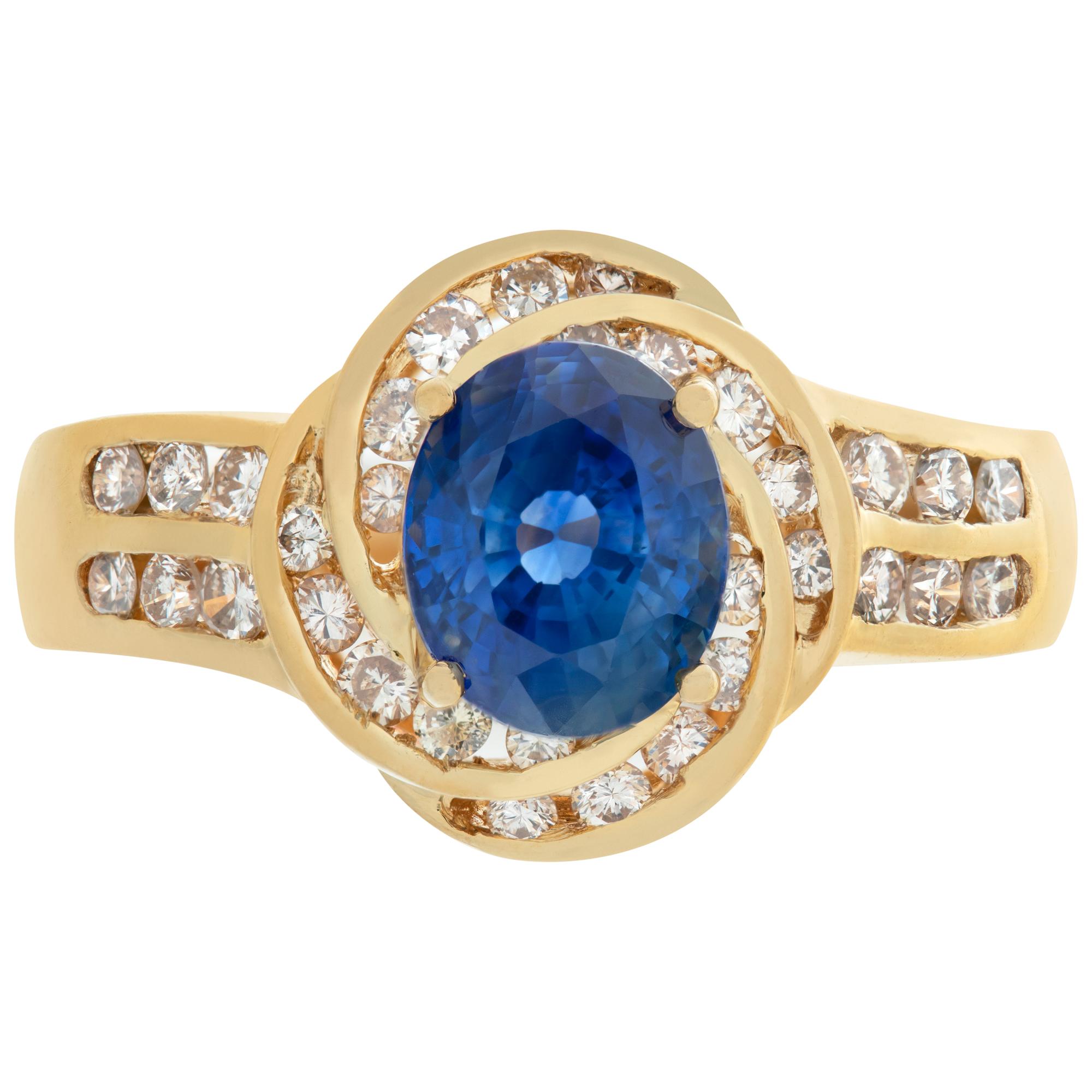 Lovely & bright blue sapphire ring with approximate 1 carat center sapphire and 0.5 carat in surrounding diamonds in 18k yellow gold. Size 6.5, width 1.5mm - 3mm.This Diamond/Sapphires ring is currently size 6.5 and some items can be sized up or