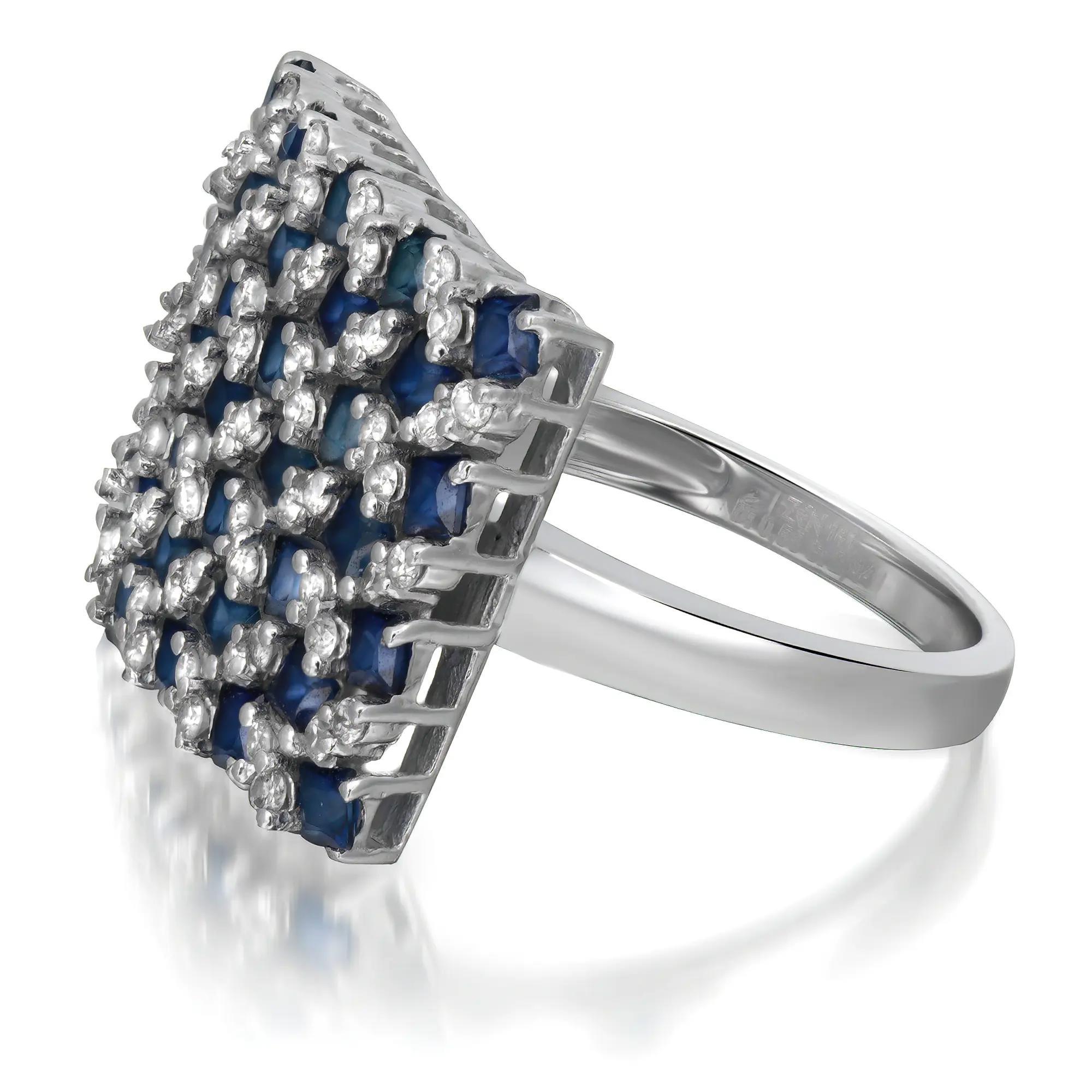 This unique square shape cocktail ring is crafted in 14k white gold. The ring features 28 princess cut blue sapphires with round cut diamonds studded in a square pattern. Total blue sapphire weight: 2.44 carats. Total diamond weight: 0.56 carat.