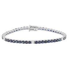 Bracelet tennis en or blanc 14 carats avec saphirs bleus de 8,31 carats et diamants de 0,32 carat