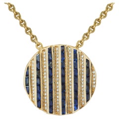 Ciondolo Agamo con zaffiro blu e diamante con montatura in oro 18 carati