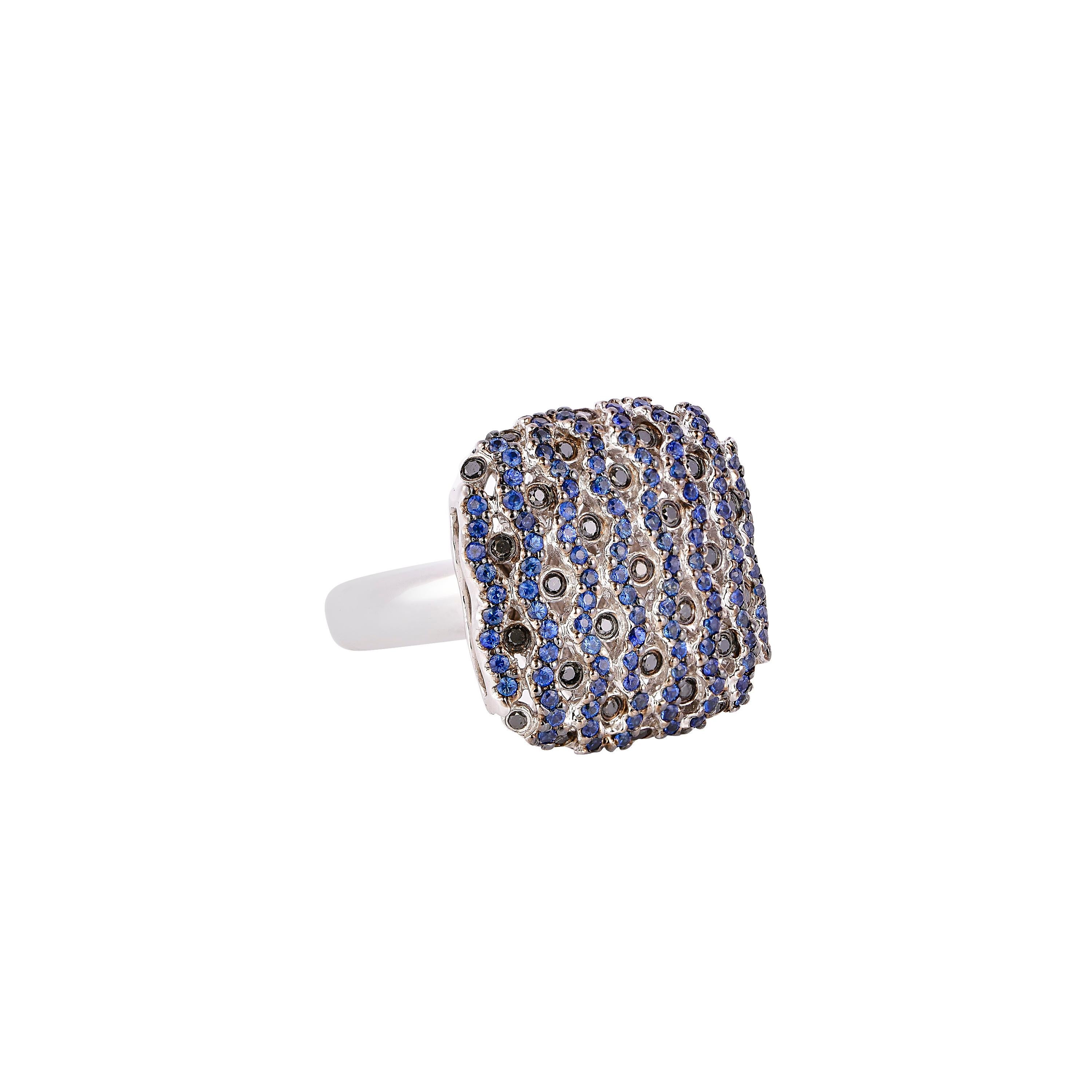 Feel the waves with these unique cocktail rings with a 'wavey' design. This ring incorporates a unique pairing of color gems with different settings of pave and bezel to add some sparkle to your ring stack. 

Fancy blue sapphire (pave) and black