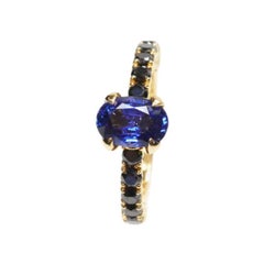 Blue Sapphire and Black Diamonds Solitaire Ring Set in 18 Karat Yellow Gold