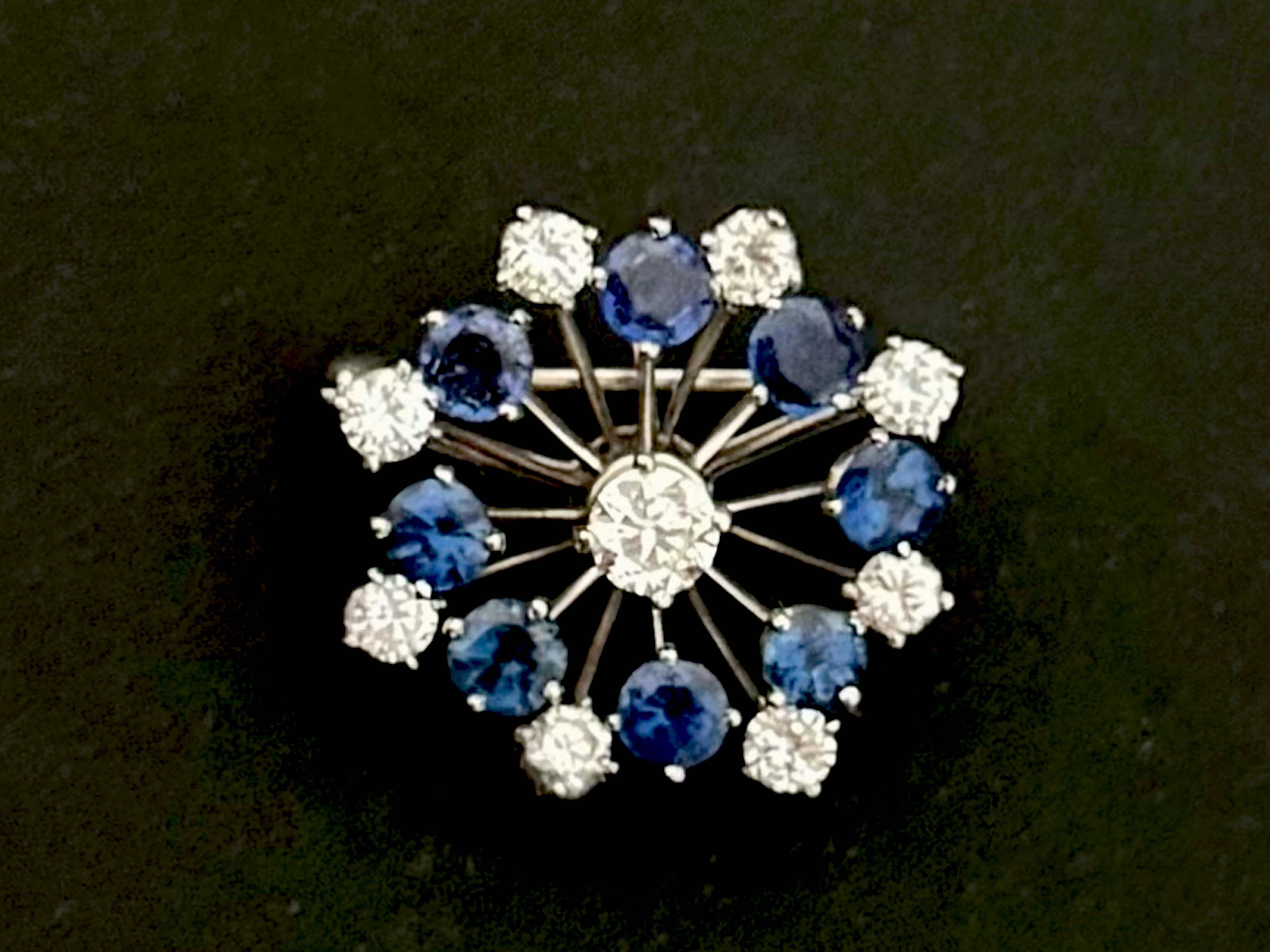 Item Specifications:

Metal: Platinum

Sapphire Count: 8 round blue sapphires

Sapphire Carat Weight: ~2.00 carats

Diamond count: 9 brilliant cut

Diamond color: G-H

Diamond clarity: VS1-SI2
​
​Diamond Carat Weight: 1.15 carats

Diameter: 0.95