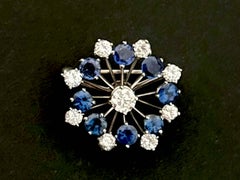 Blue Sapphire and Brilliant Cut Diamond Flower Brooch in Platinum