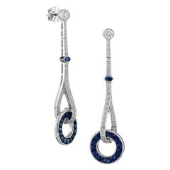 Orecchini a ciambella con zaffiro blu e diamanti in stile Art Déco in oro bianco 18 carati