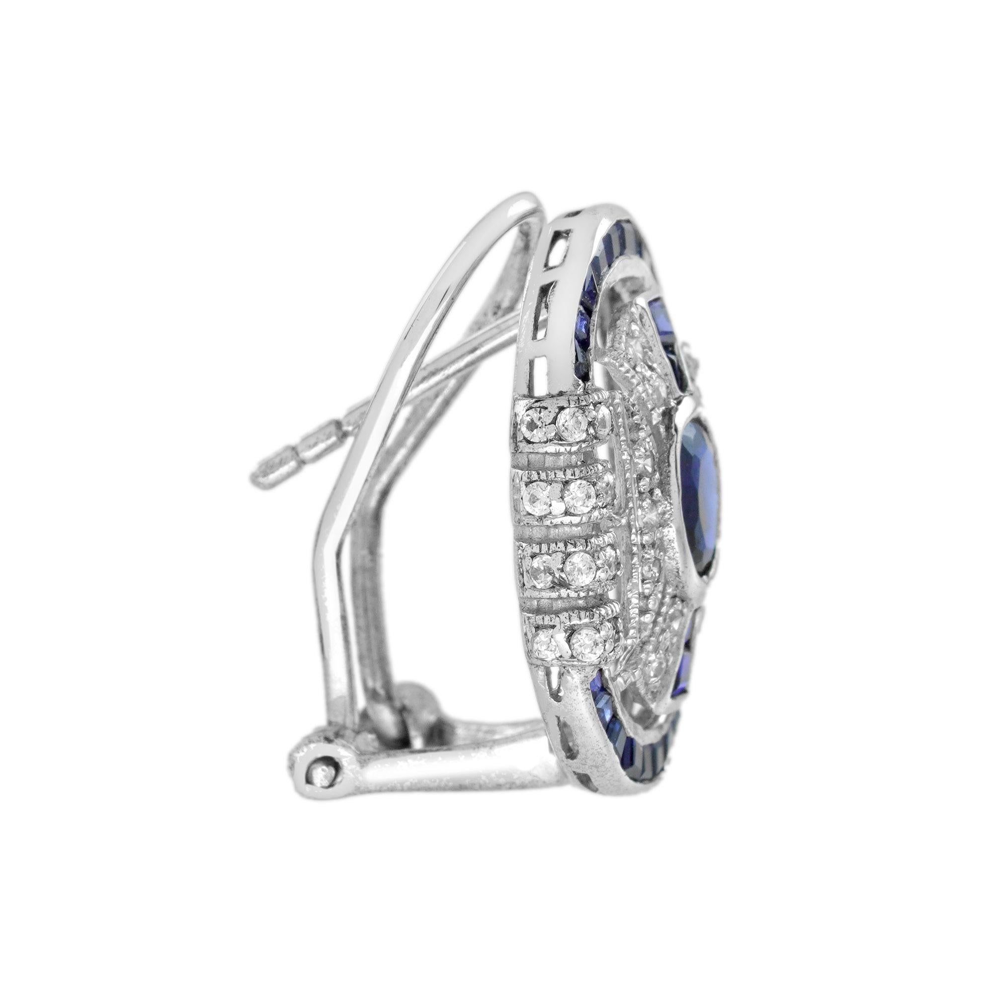 Oval Cut Blue Sapphire and Diamond Art Deco Style Omega Earrings in 18K White Gold For Sale