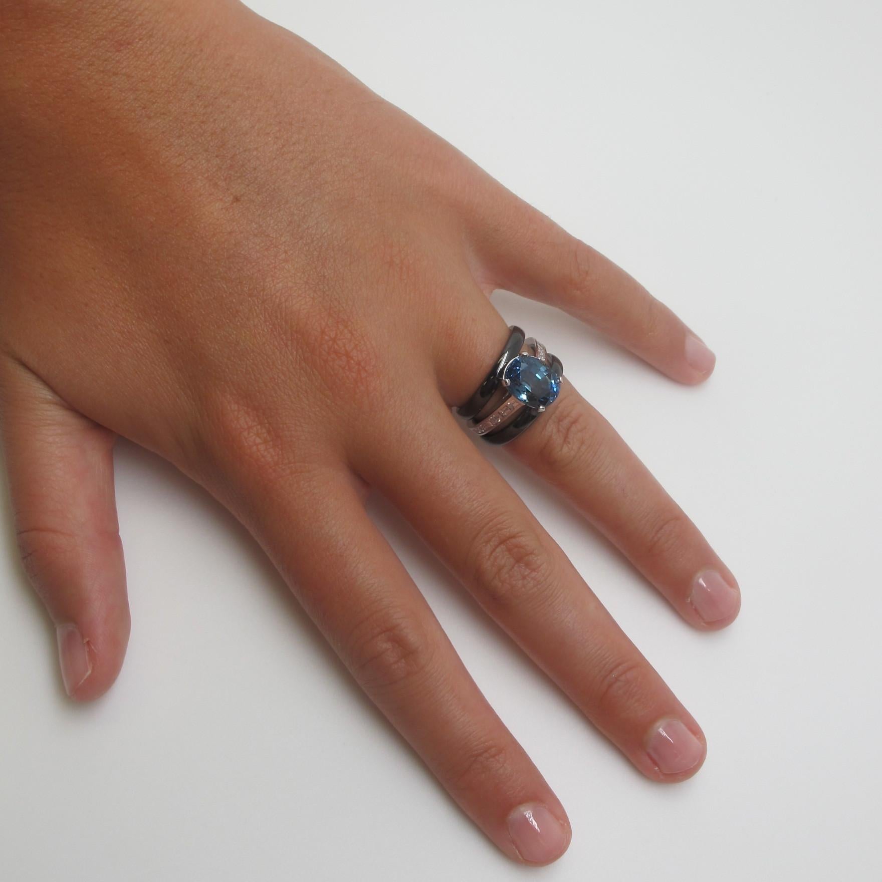 For the modern woman.  A large, denim color,  blue sapphire (10.20x6.60mm/5.70 carats) is set in our 