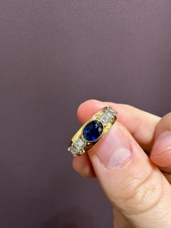 Blue Sapphire and Diamond Band Ring set in Yellow Gold