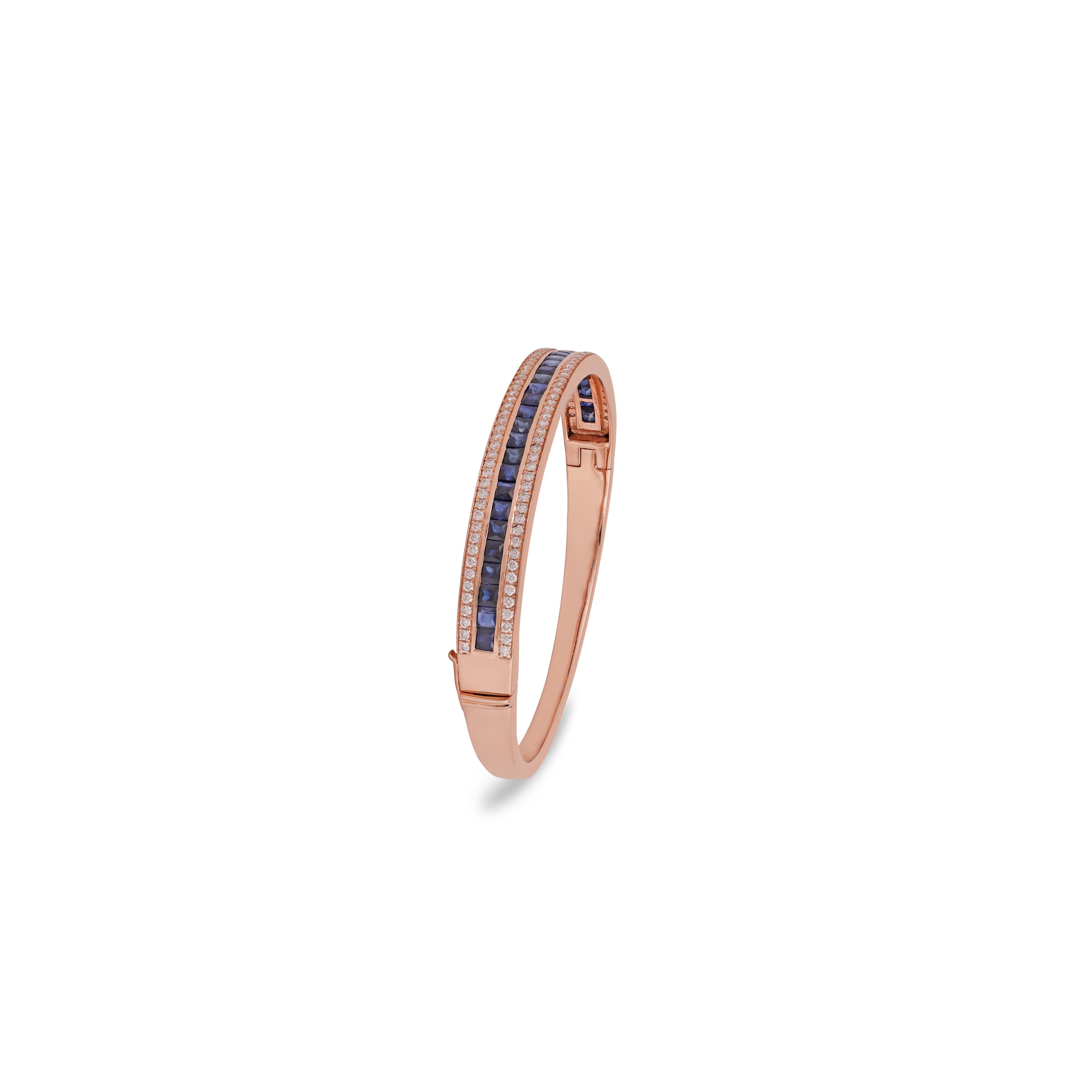 Its a classic bangle studded with blue sapphire & diamonds features 106 Blue sapphires weight 3.35 carats with 30 pieces bangle entirely made of 18k Rose gold weight 22.58 grams, this bangle can be open from the side which makes it easy to put on.
