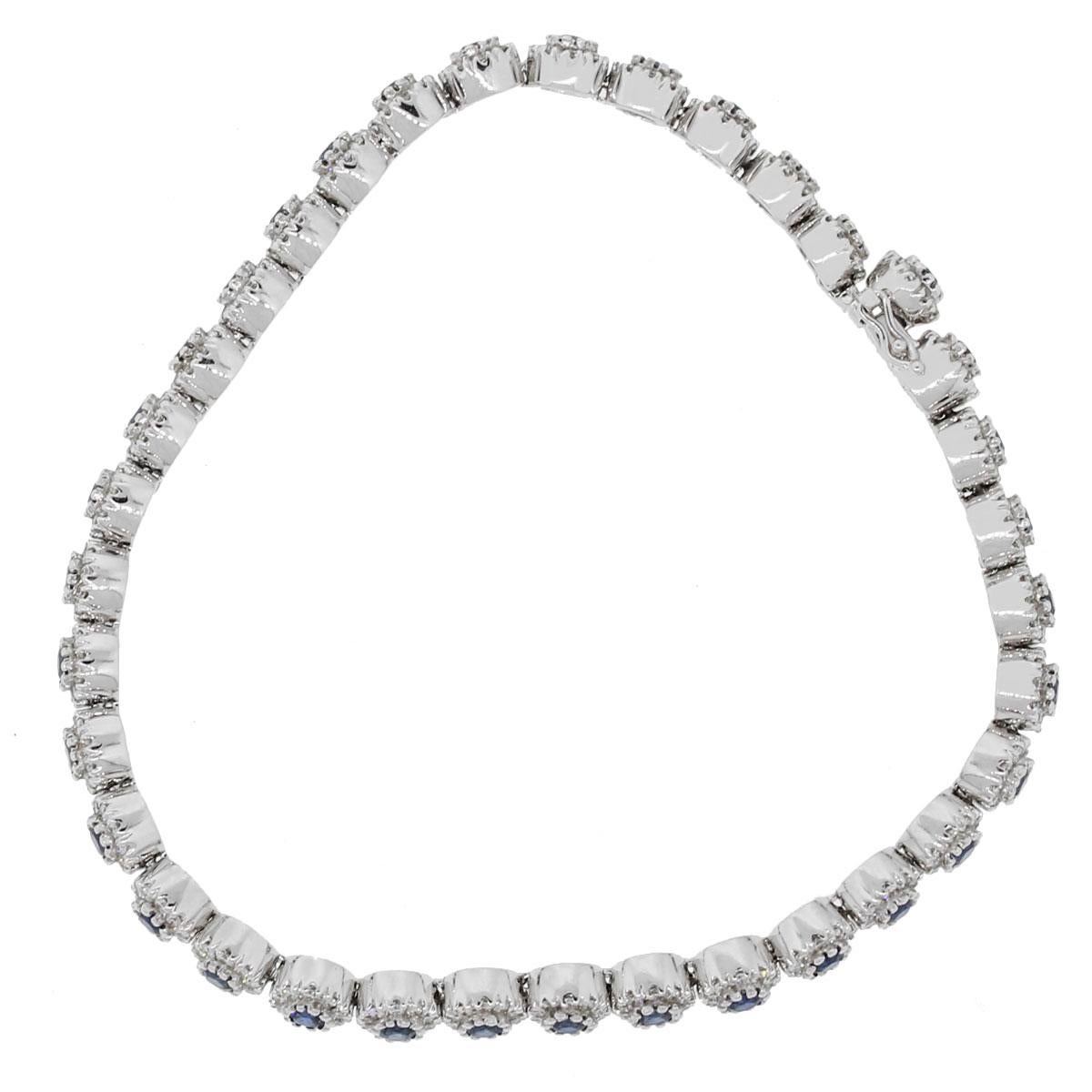 Material: 14k White Gold
Diamond Details: Approximately 1.71ctw of round brilliant cut diamonds. Diamonds are G/H in color and VS in clarity.
Gemstone Details: Approximately 2.29tw of round blue sapphire gemstones.
Measurements: 7″ x 0.19″ x
