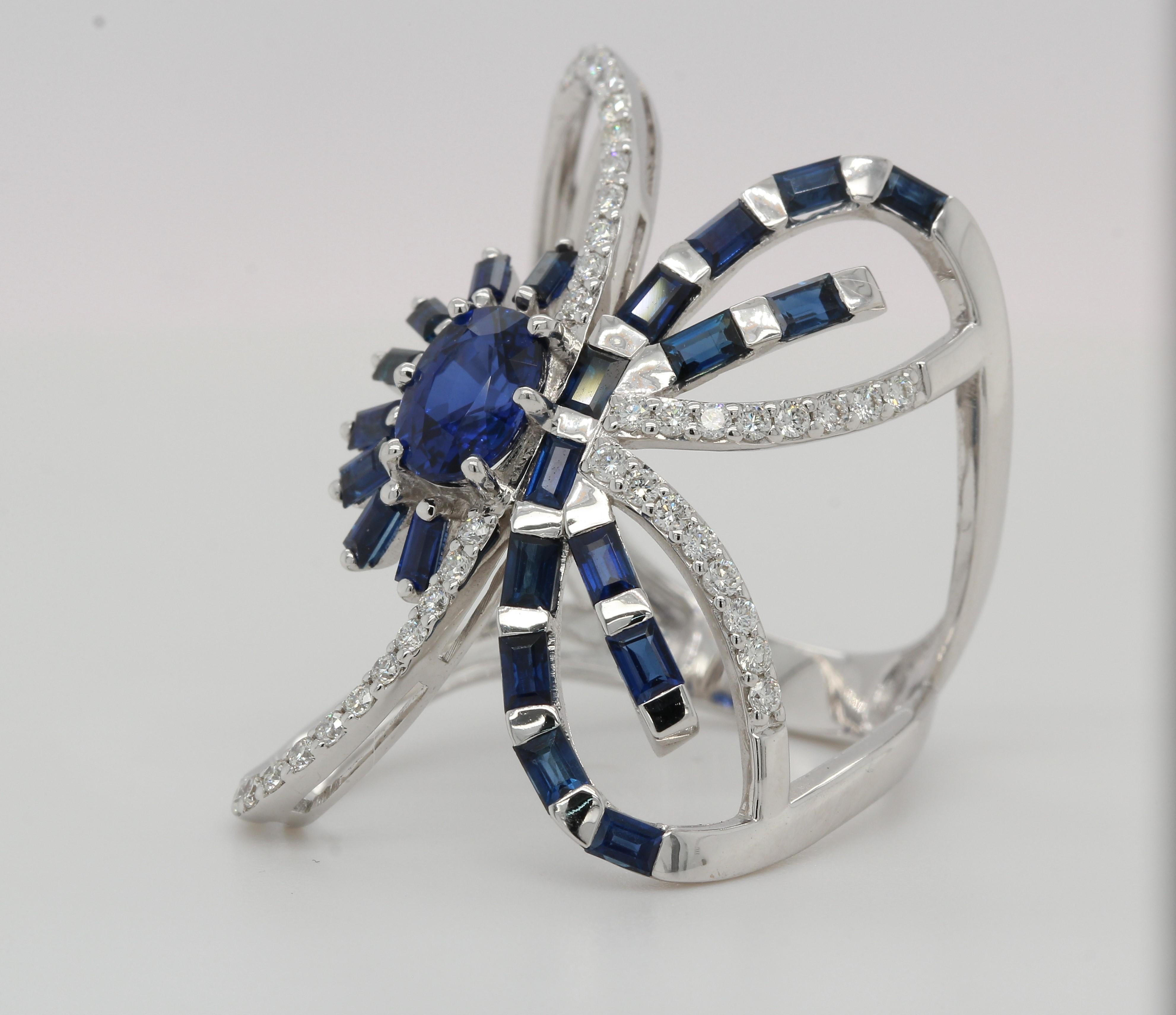 Oval Cut Blue Sapphire and Diamond Butterfly Ring in 18 Karat Gold For Sale