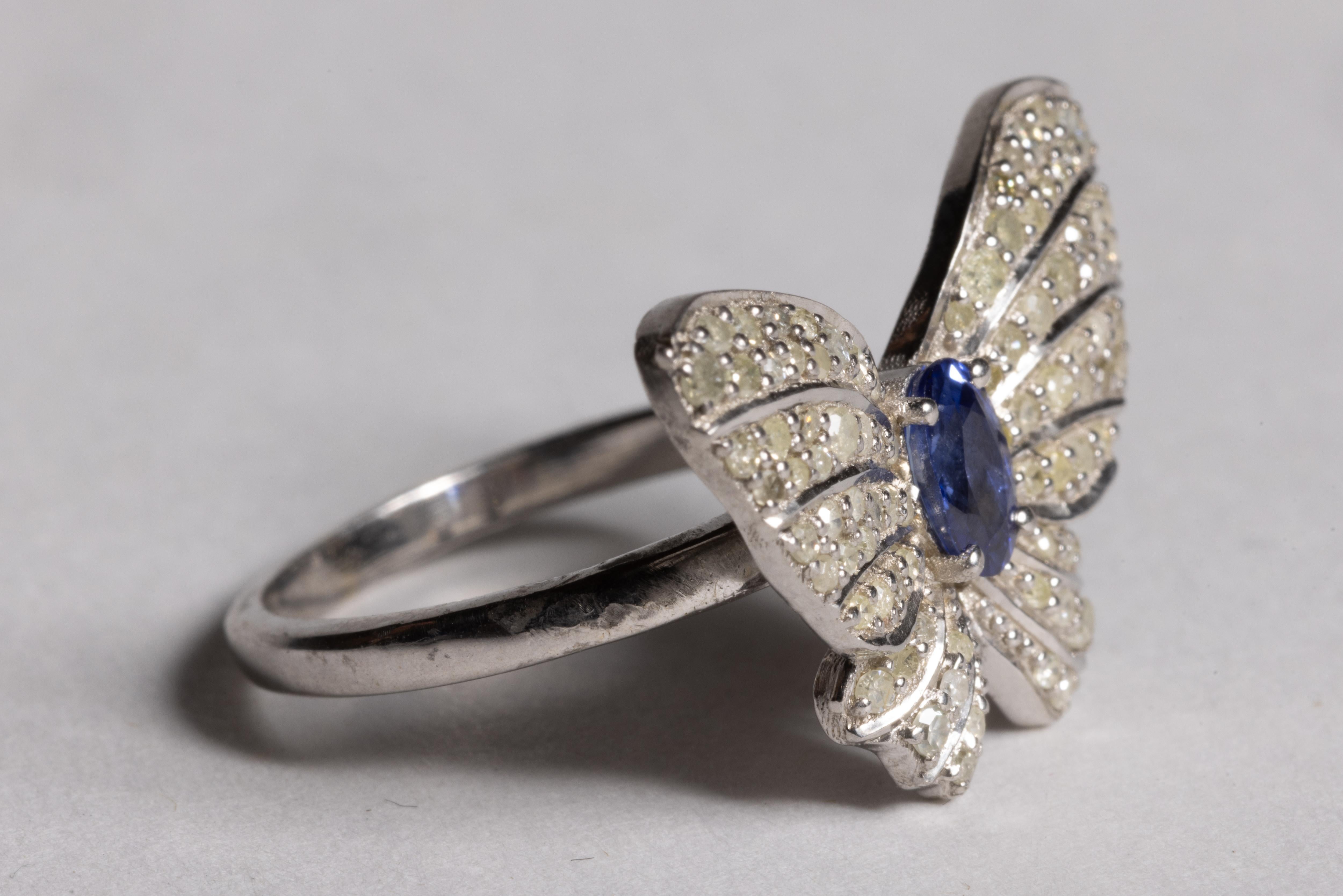 Round Cut Blue Sapphire and Diamond Buttlerfly Motif Ring For Sale