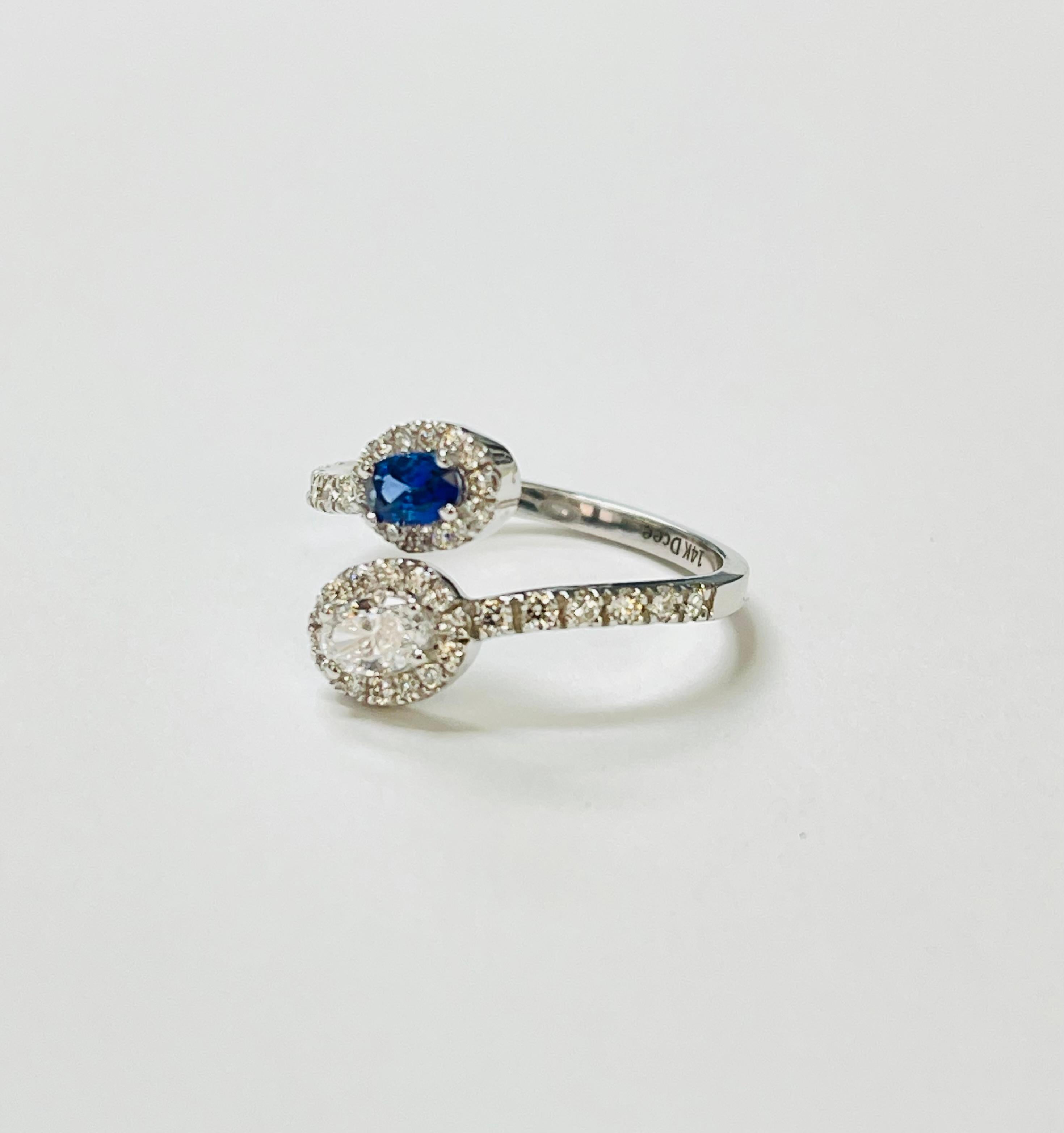 Blue Sapphire and Diamond By Pass Engagement Ring In 14 karat White Gold. Corte oval en venta