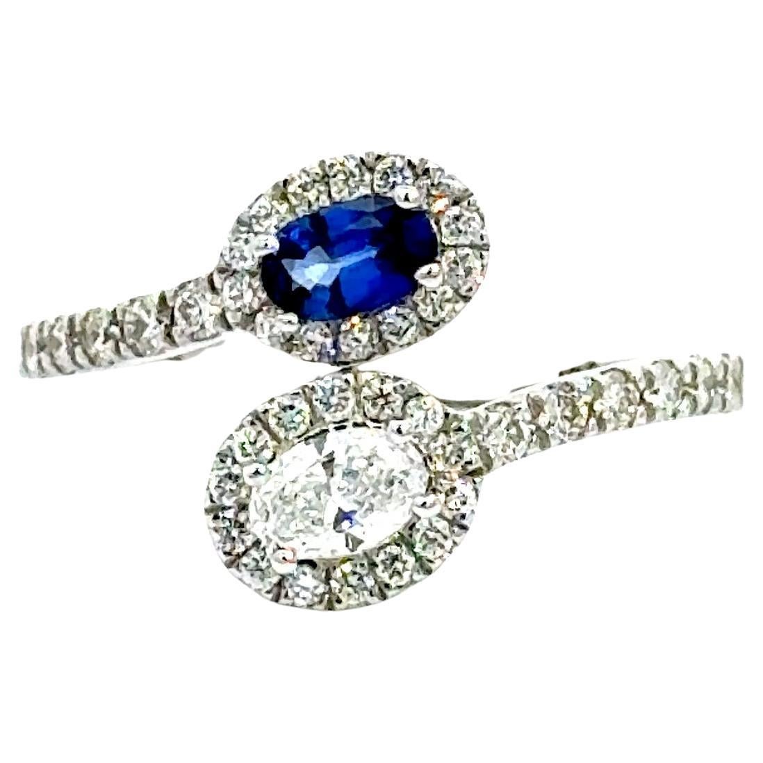 Blue Sapphire and Diamond By Pass Engagement Ring In 14 karat White Gold.