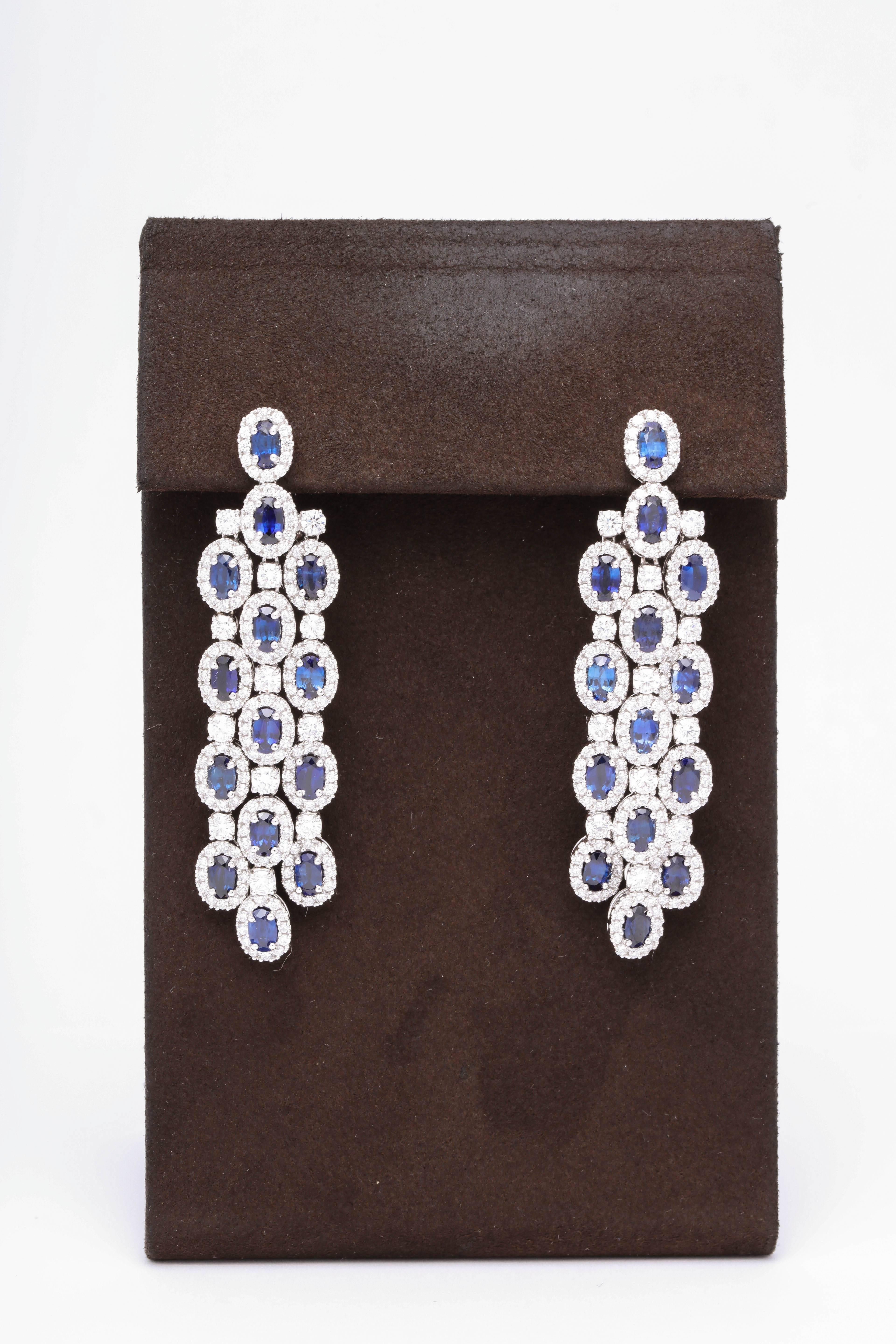 
A beautiful pair of classic chandelier earrings with a pop of BLUE!

8.46 carats of blue sapphires 

4.90 carats of white round brilliant cut diamonds

18k white gold 

Approximately 2.36 inches in length, .70 inches wide. 