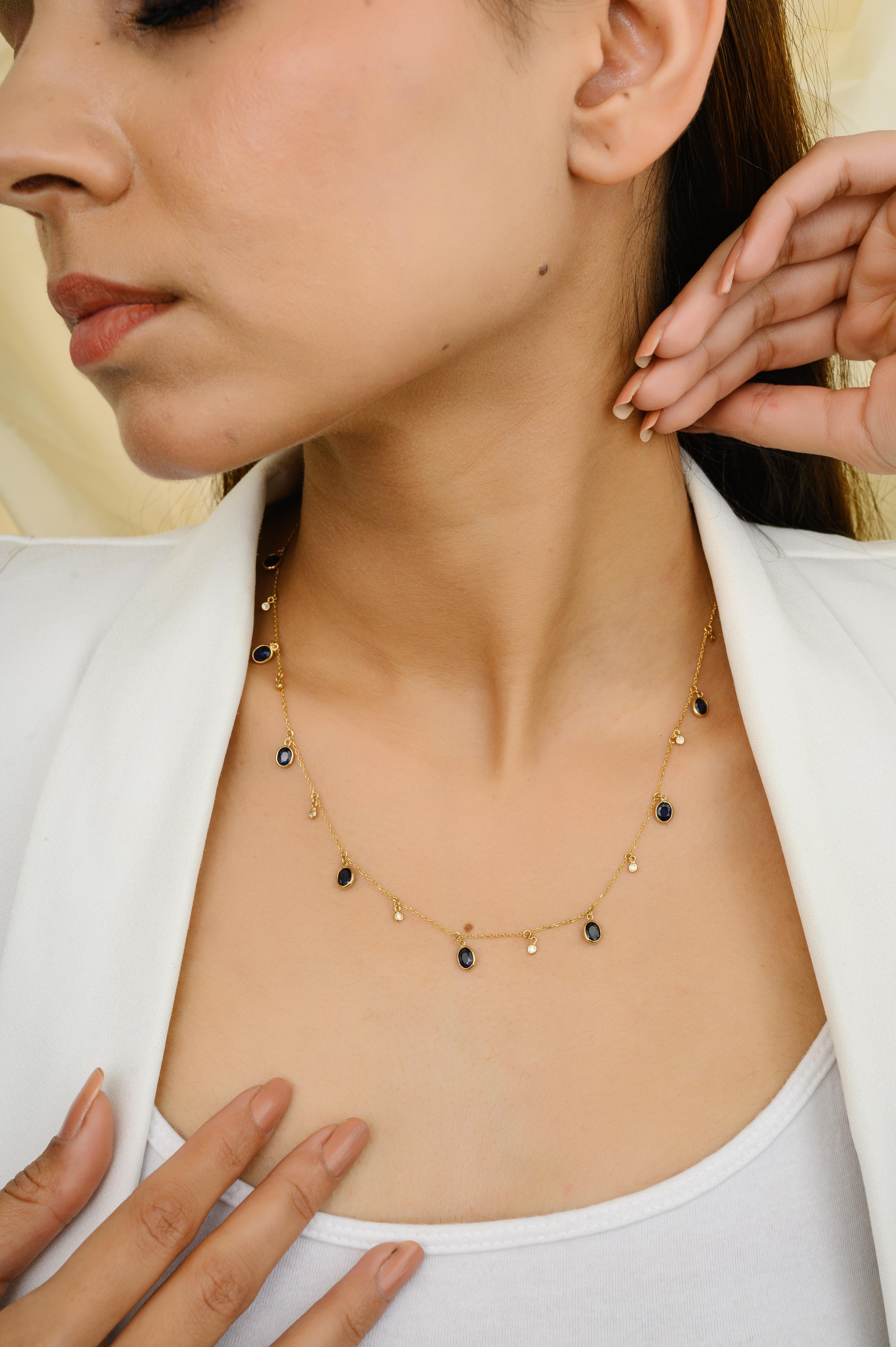 Blue Sapphire and Diamond Charm Layering Necklace in 18K Gold with oval cut blue sapphire and diamonds. This stunning piece of jewelry instantly elevates a casual look or dressy outfit. 
Sapphire stimulates concentration and reduces stress.
Designed